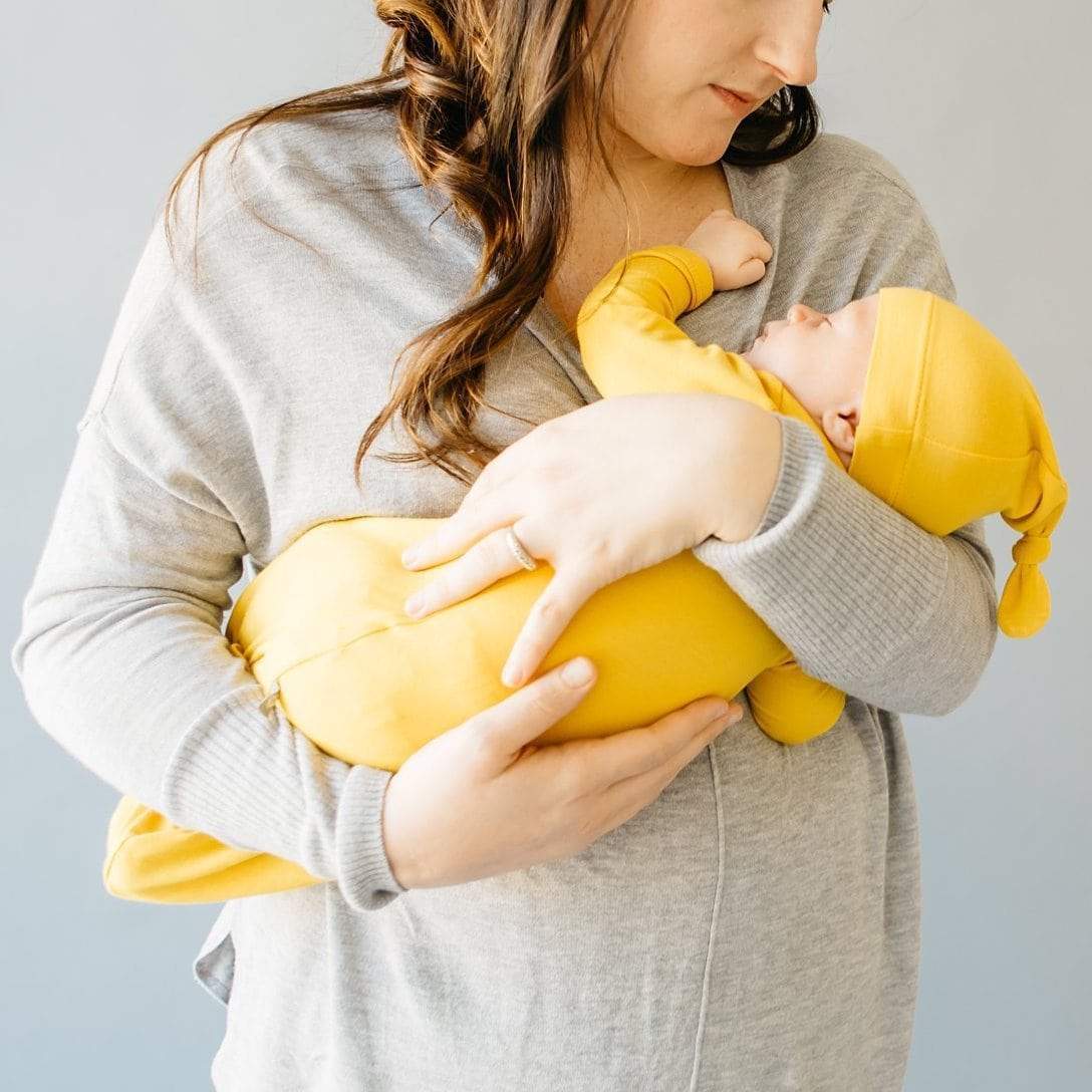 infant being comforted by mother at sleep time