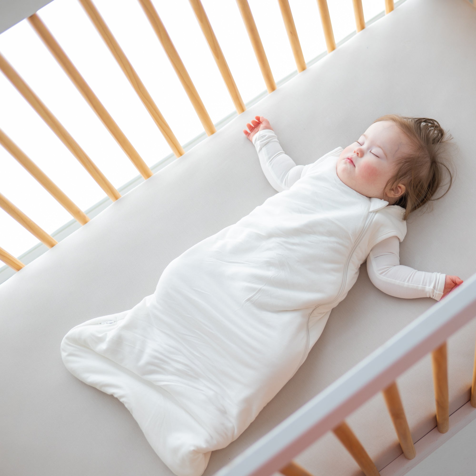 Infant sleeping in which sleep bag and long sleeve bodysuit