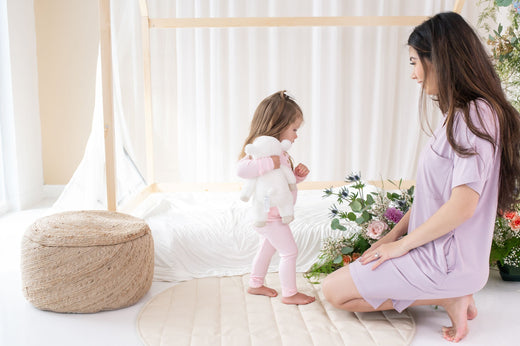 Mom with toddler near toddler bed