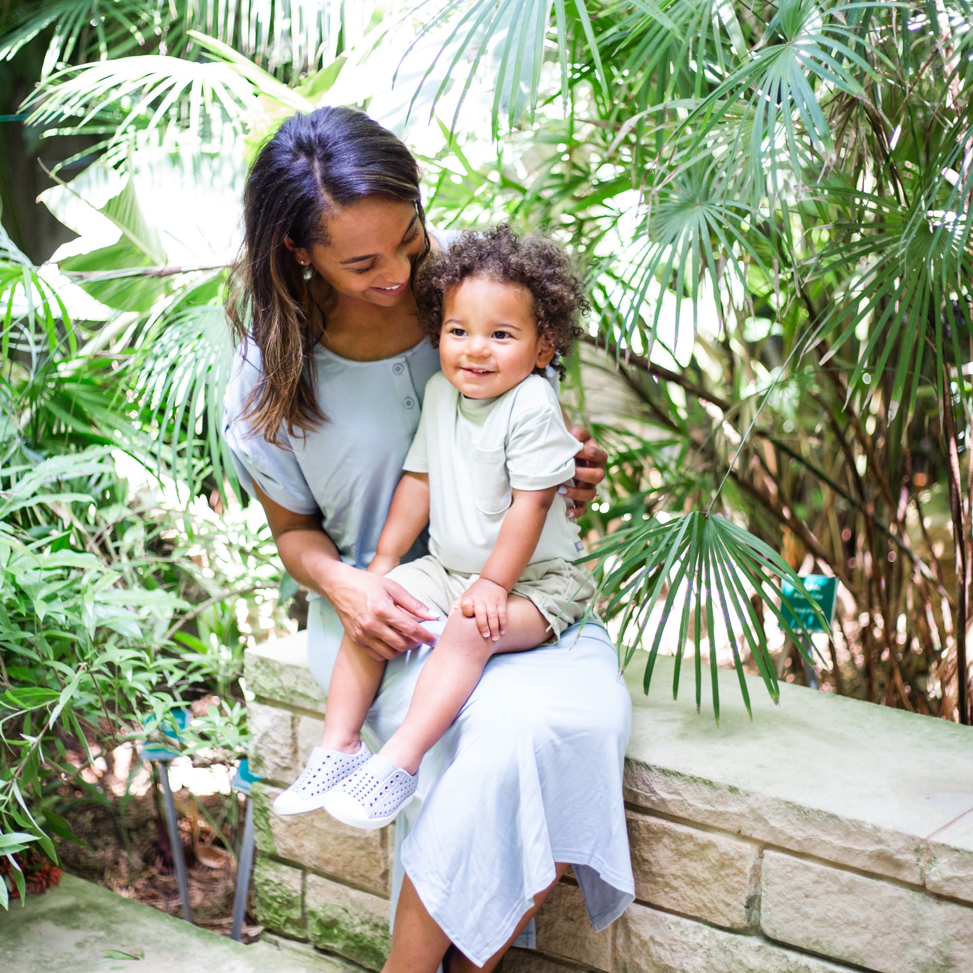 mom cuddling toddler