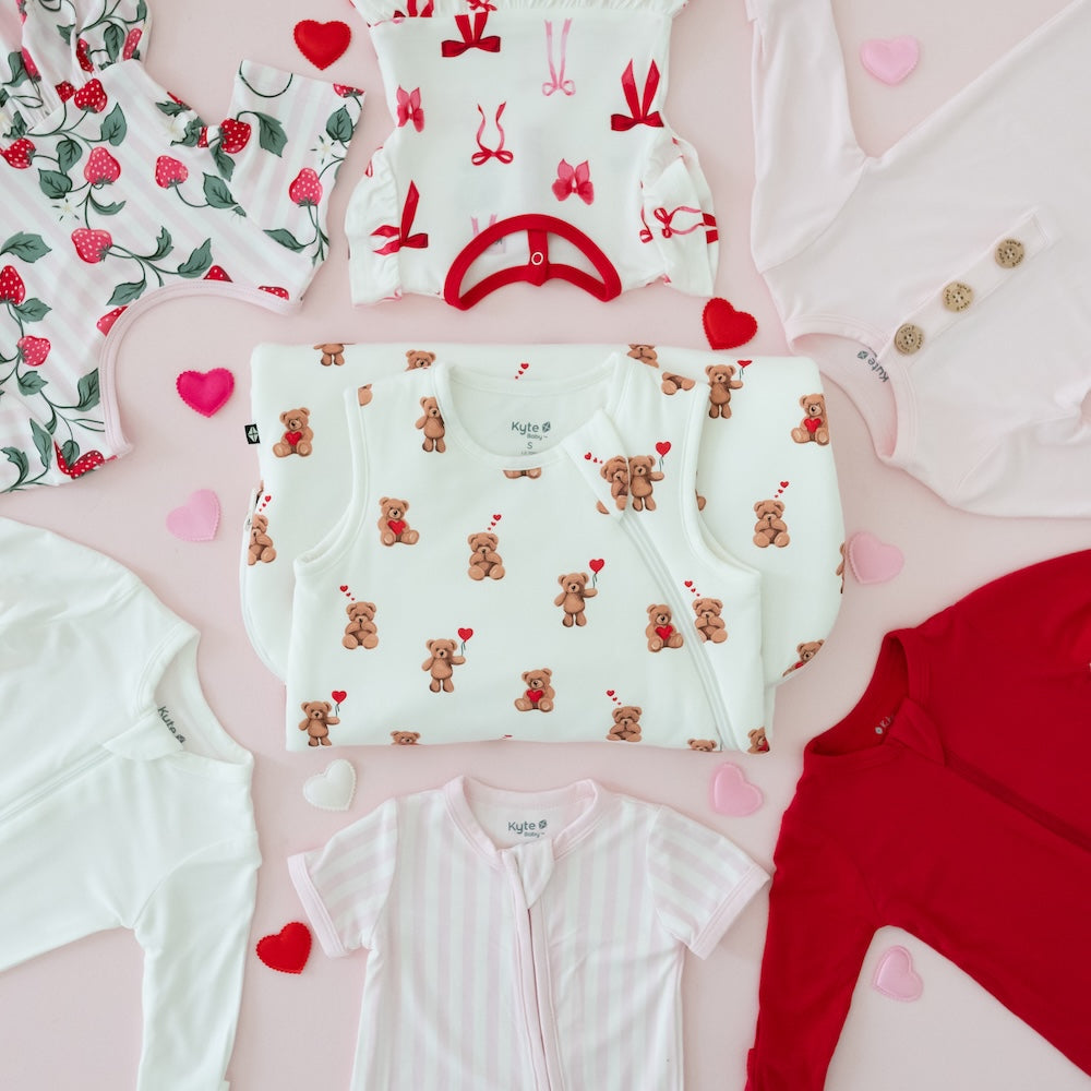 Valentine's Day flat lay including solids and prints that are red, pink, purple and white