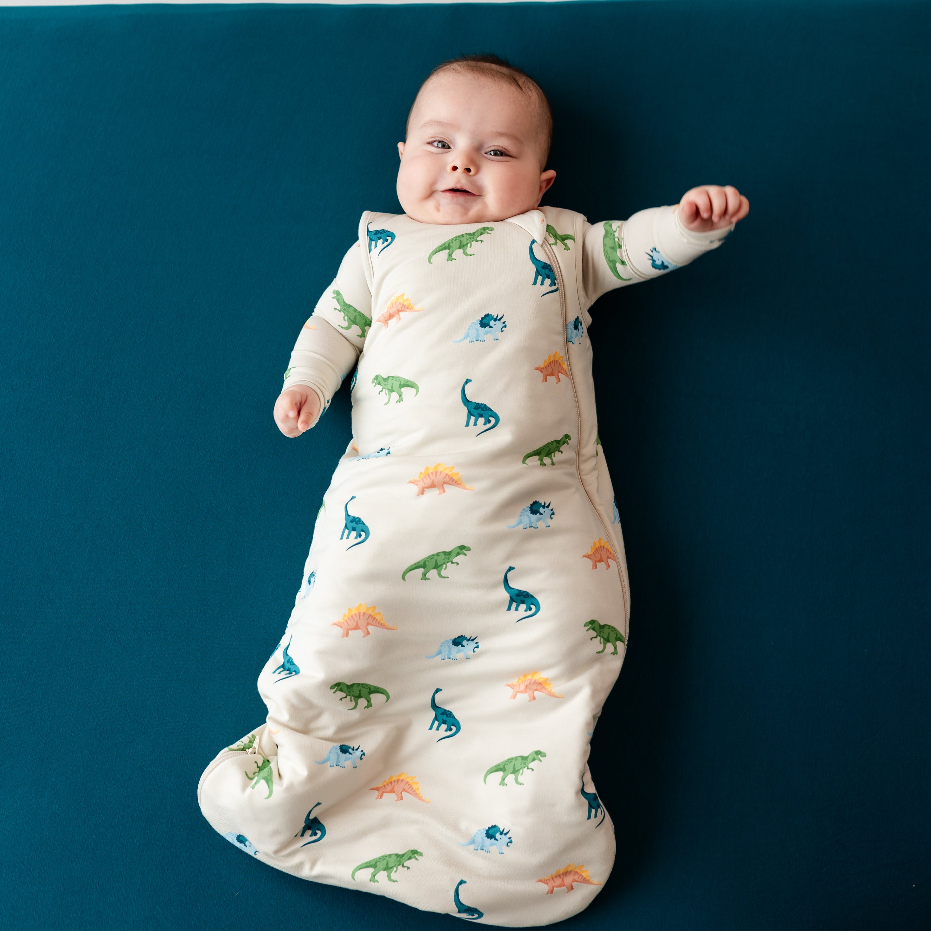 Happy baby modeling Kyte Baby 1.0 TOG Sleep Bag in Ecru Roar