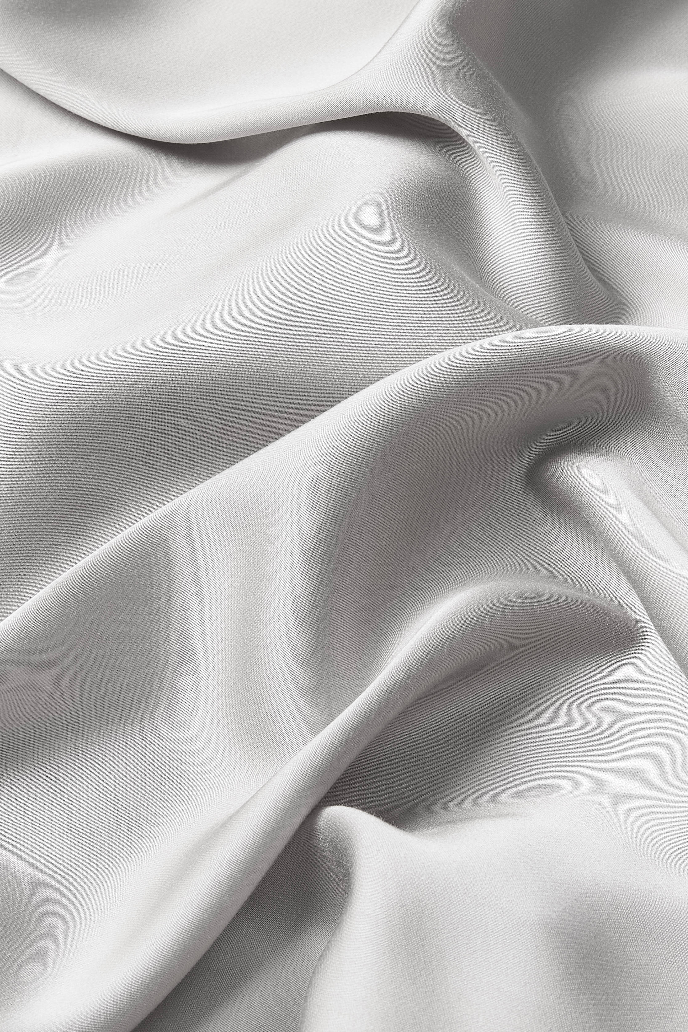 Close up of the bamboo sateen fabric: A warm grey