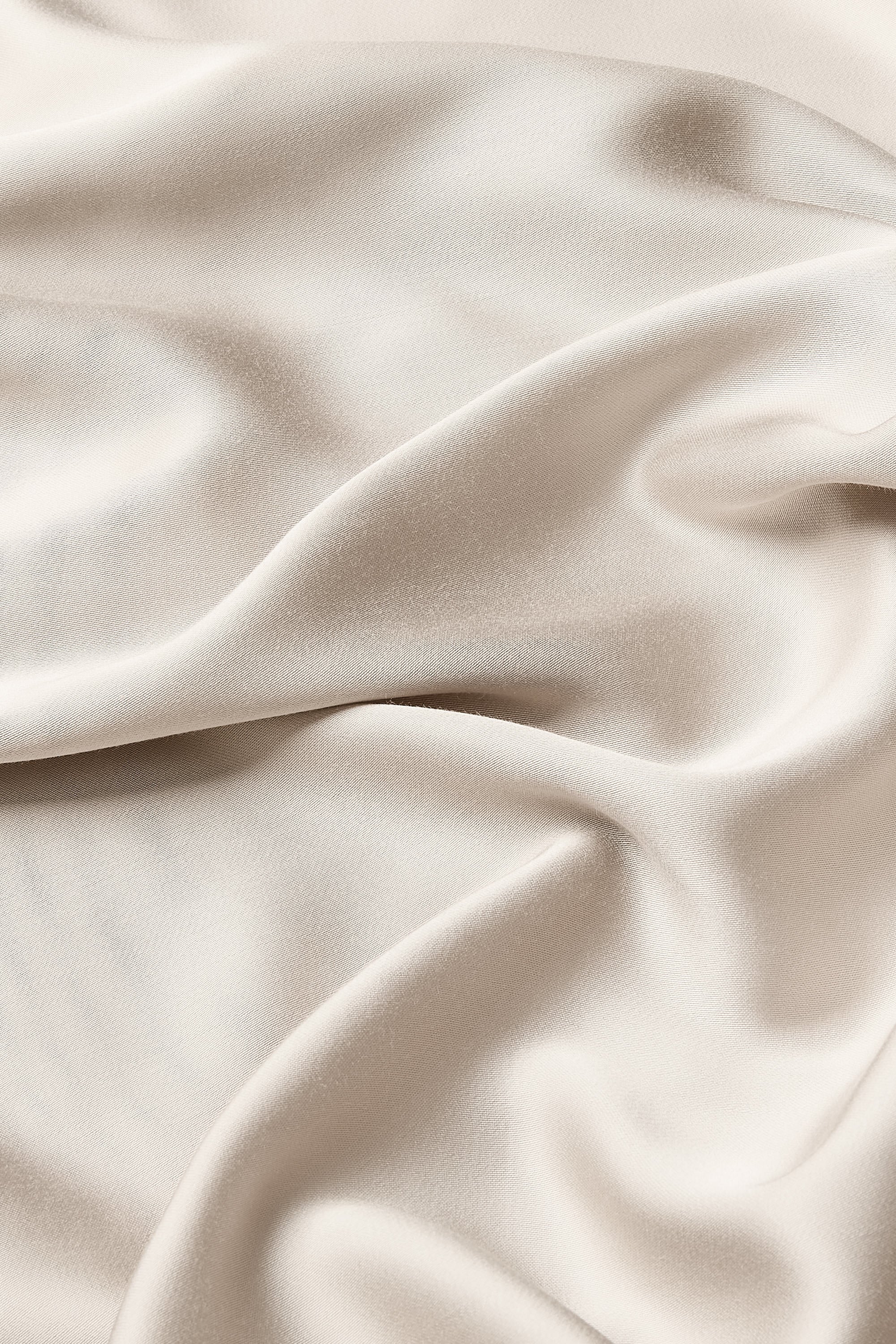 Close up of the bamboo sateen fabric: A dark beige