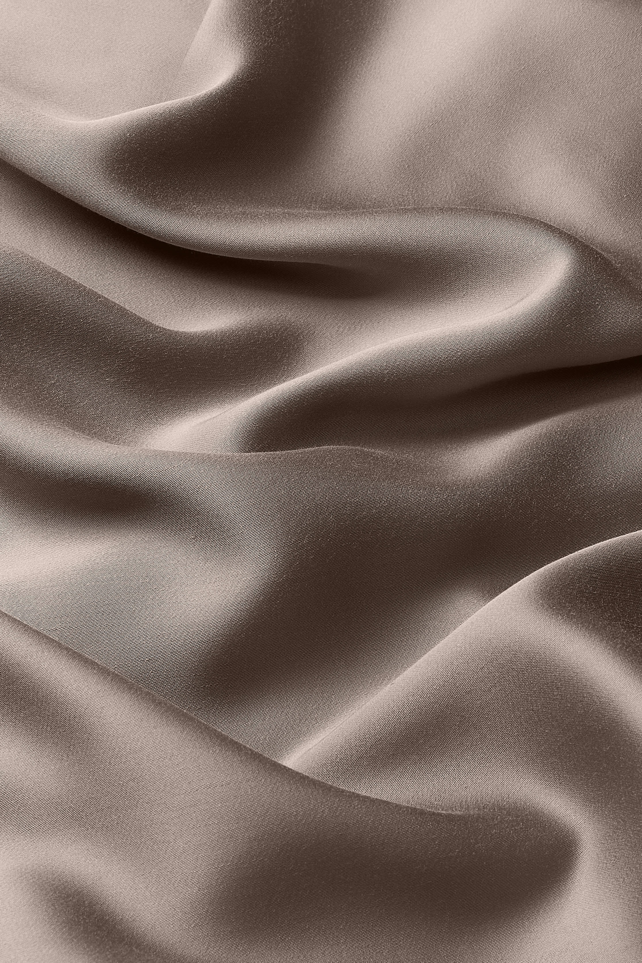 Close up of the bamboo sateen material: A medium grey-brown