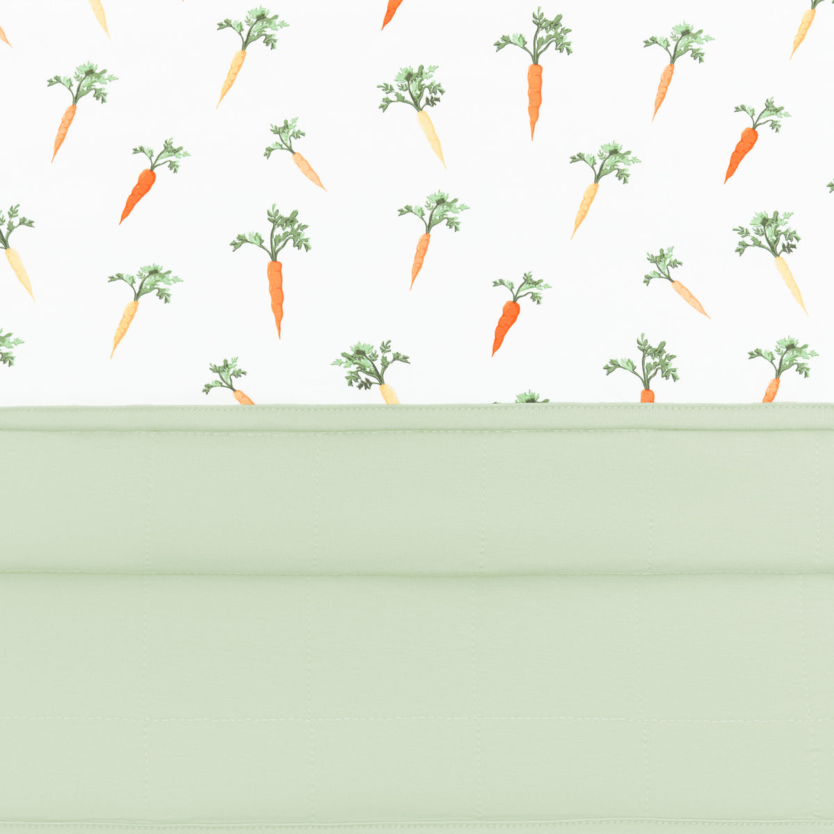 Close up of the quilted backing and smooth top of the Baby Blanket in Carrot