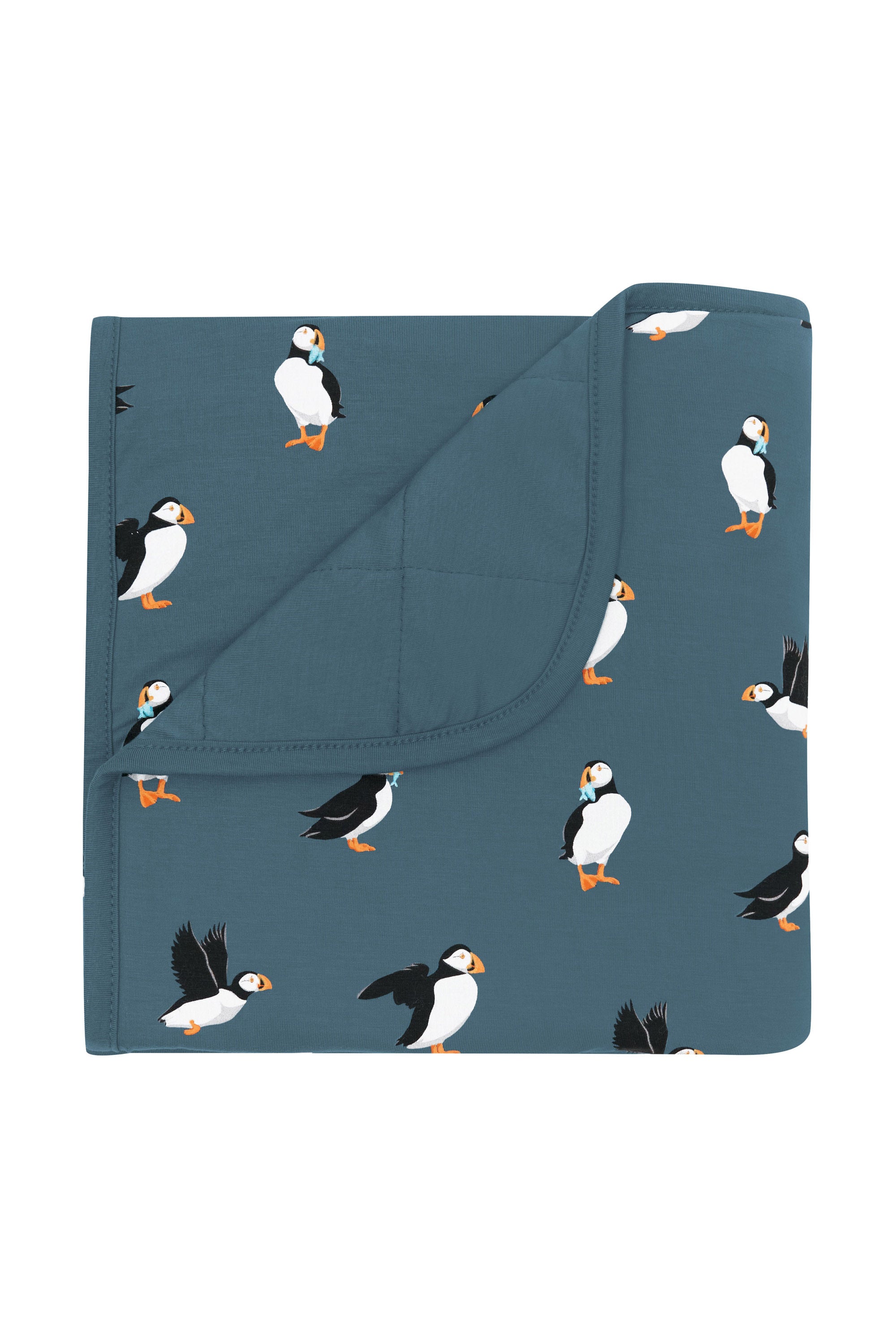 Baby Blanket in Puffin with the corner flipped over showing the Atlantic color backing