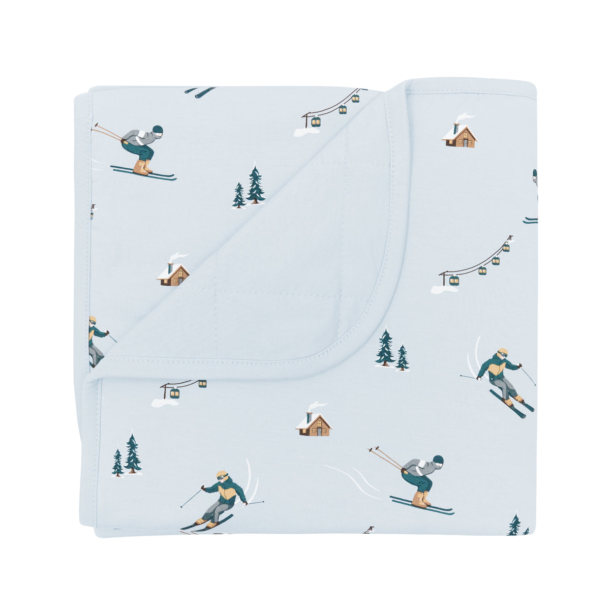 Baby Blanket in Ski with the corner flipped down showing the light blue backing resting on a white surface