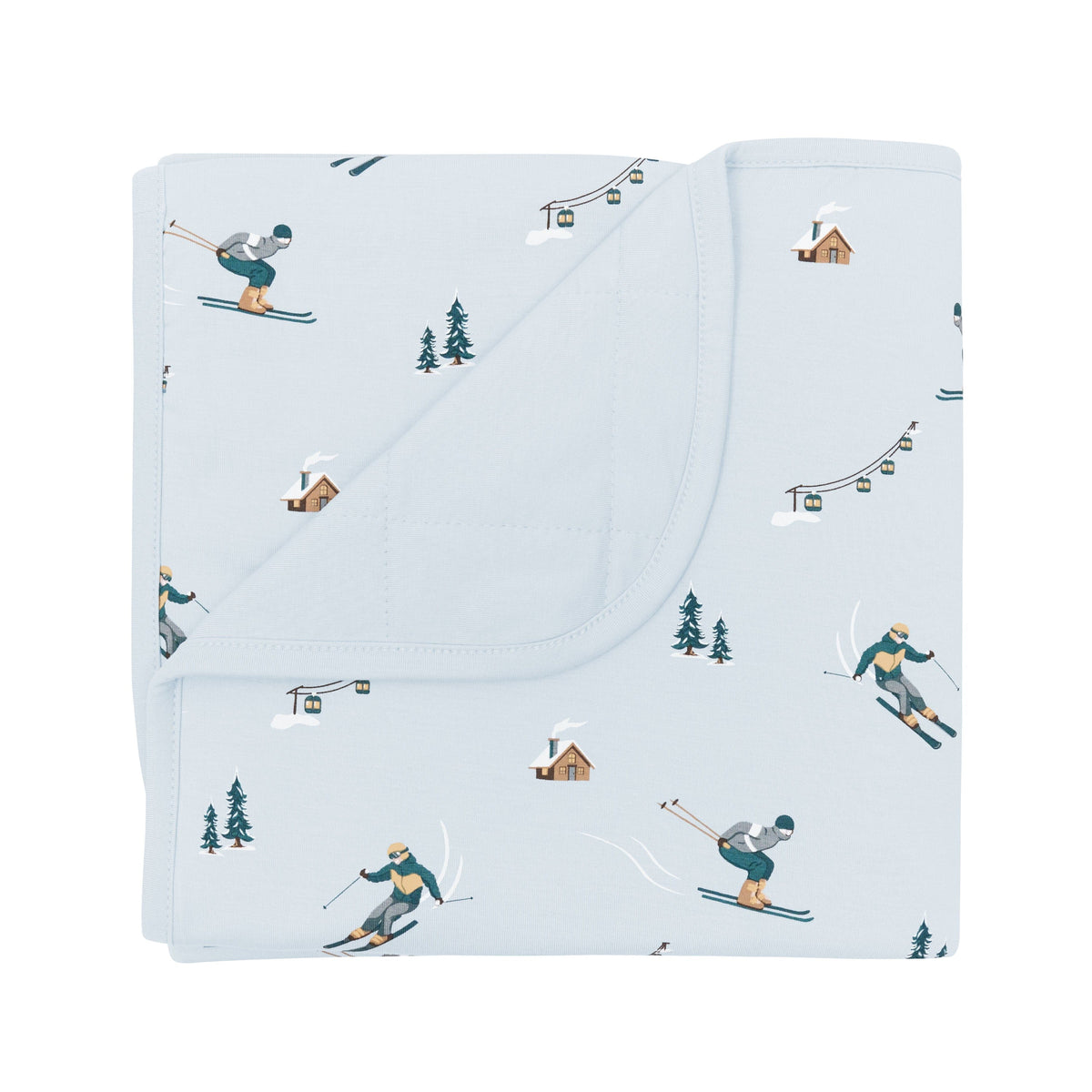 Baby Blanket in Ski with the corner flipped down showing the light blue backing resting on a white surface