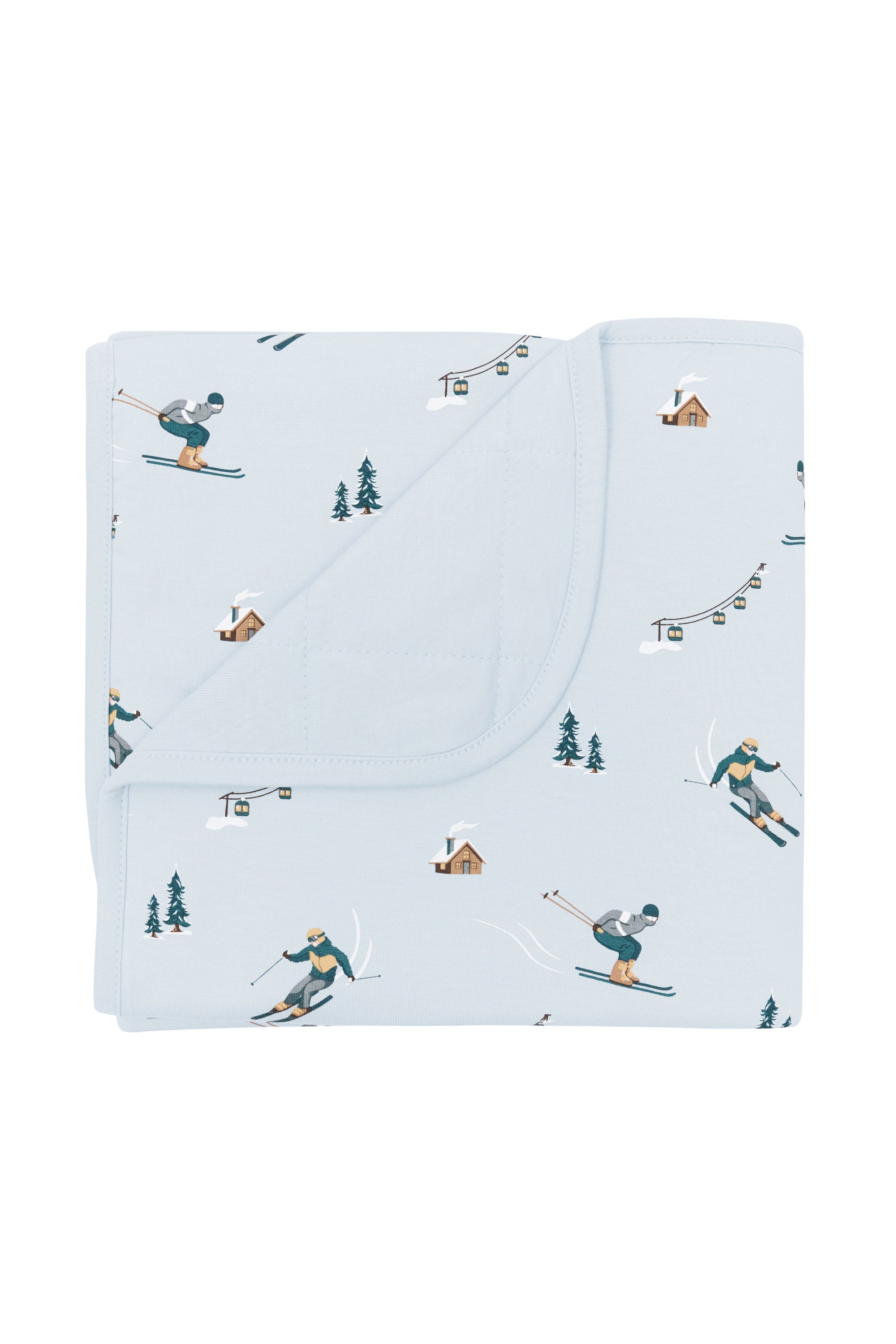 Baby Blanket in Ski with the corner flipped down showing the light blue backing resting on a white surface