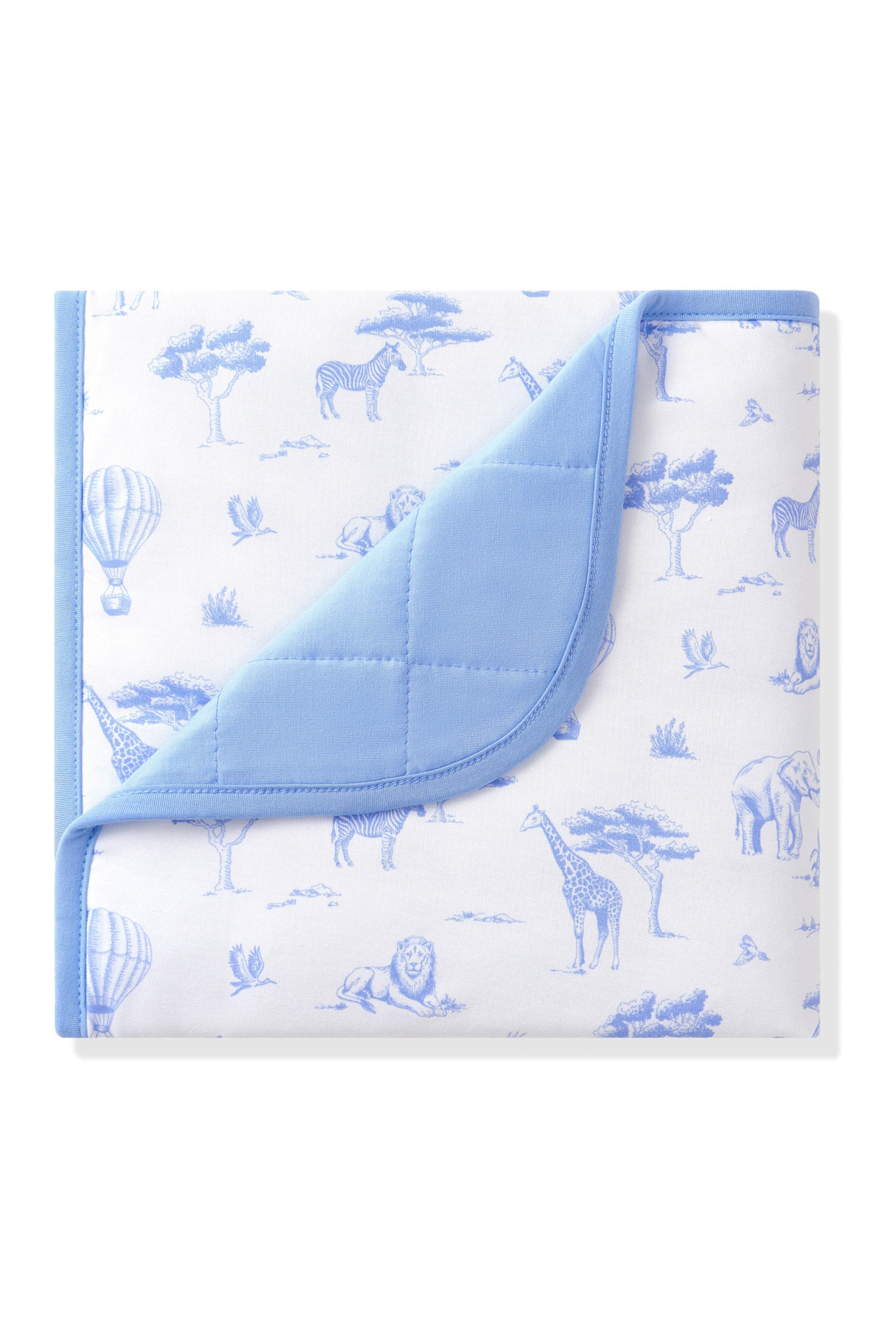 Baby Blanket in Toile Safari with the corner folded down showing the blue backing