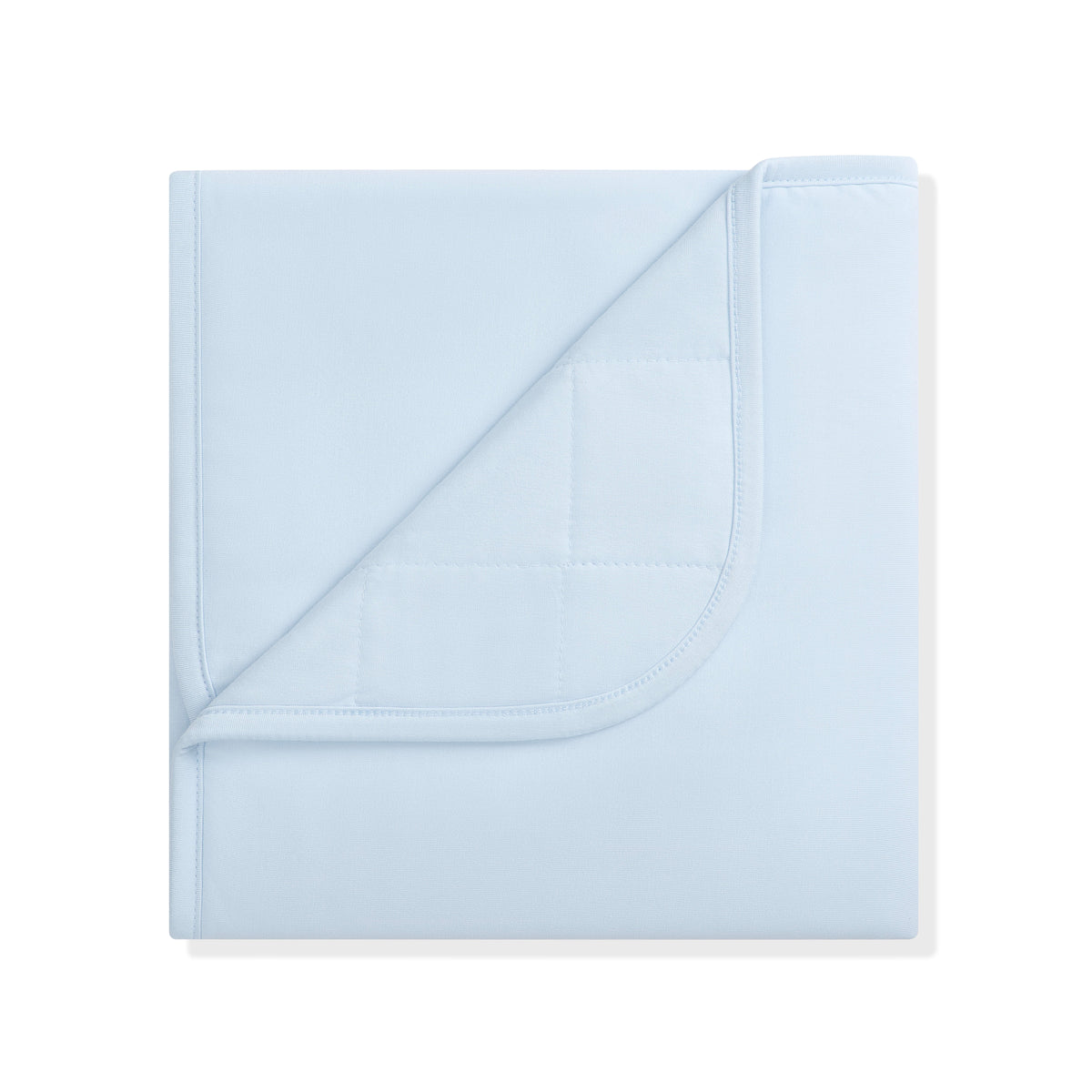 Baby Blanket in Breeze 1.0 with the corner flipped down showing the quilted backing