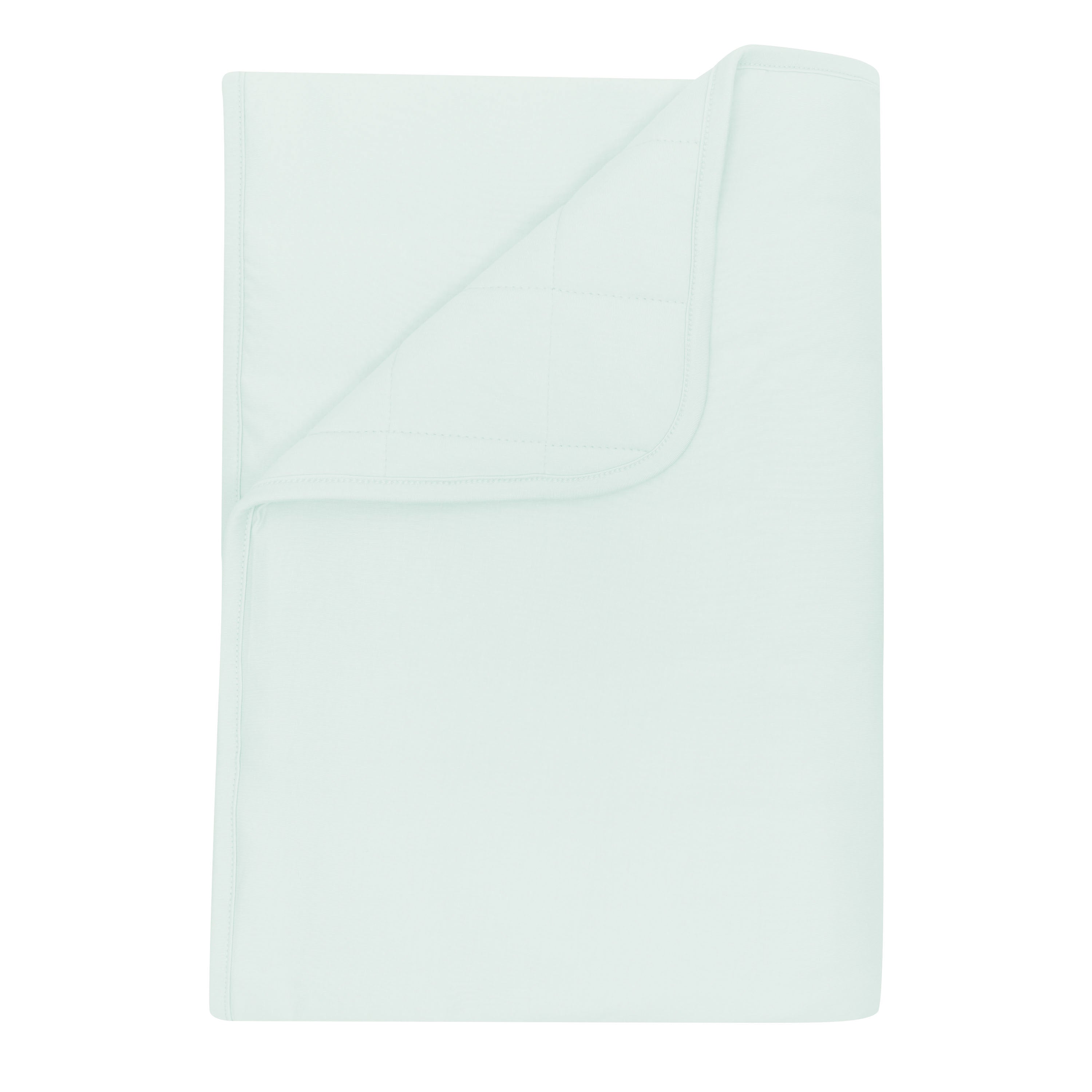 Toddler Blanket in Dew 2.5 shown with a corner flipped down showing the quilted backing