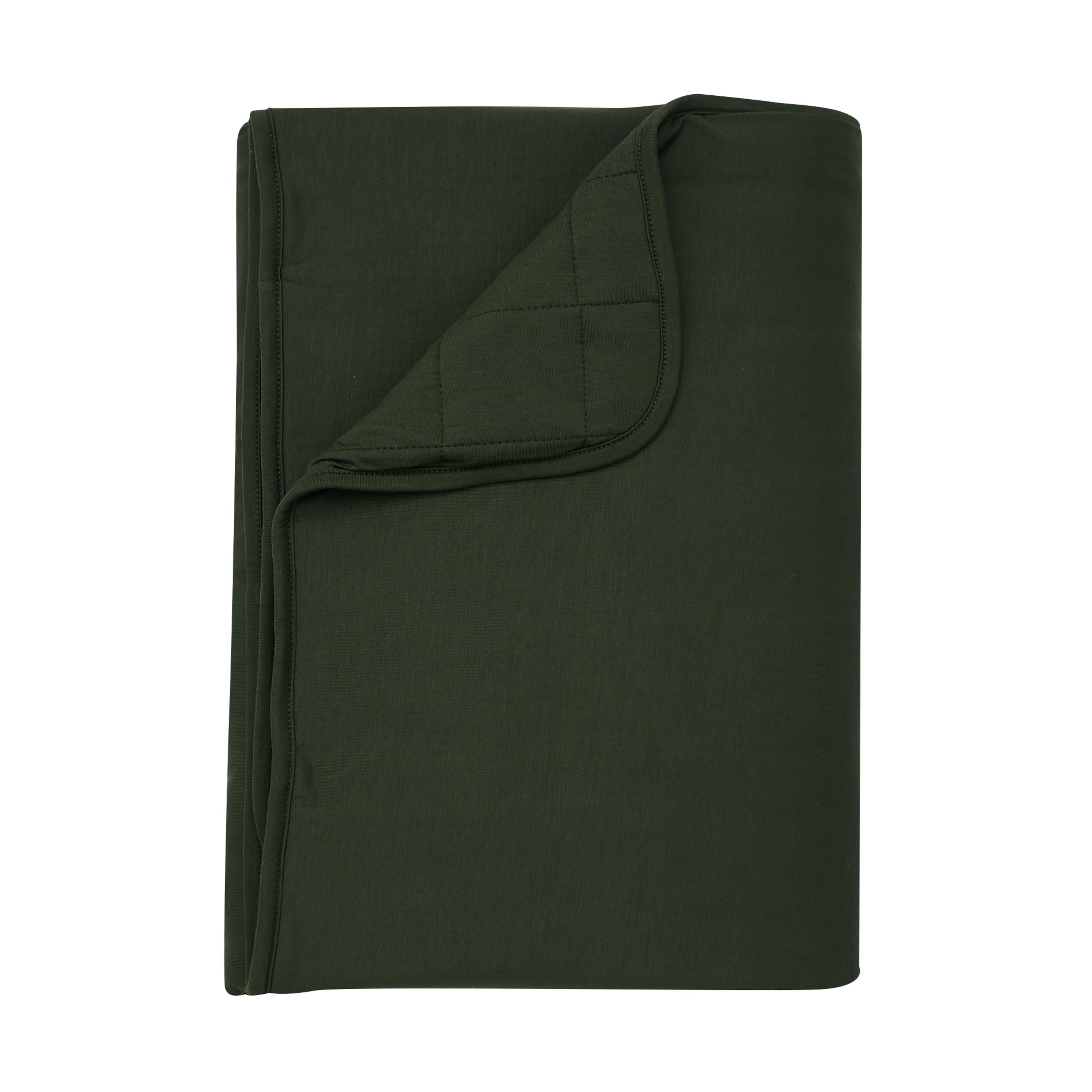 Product photo of the Toddler Blanket in Fir 2.5 with a corner flipped down