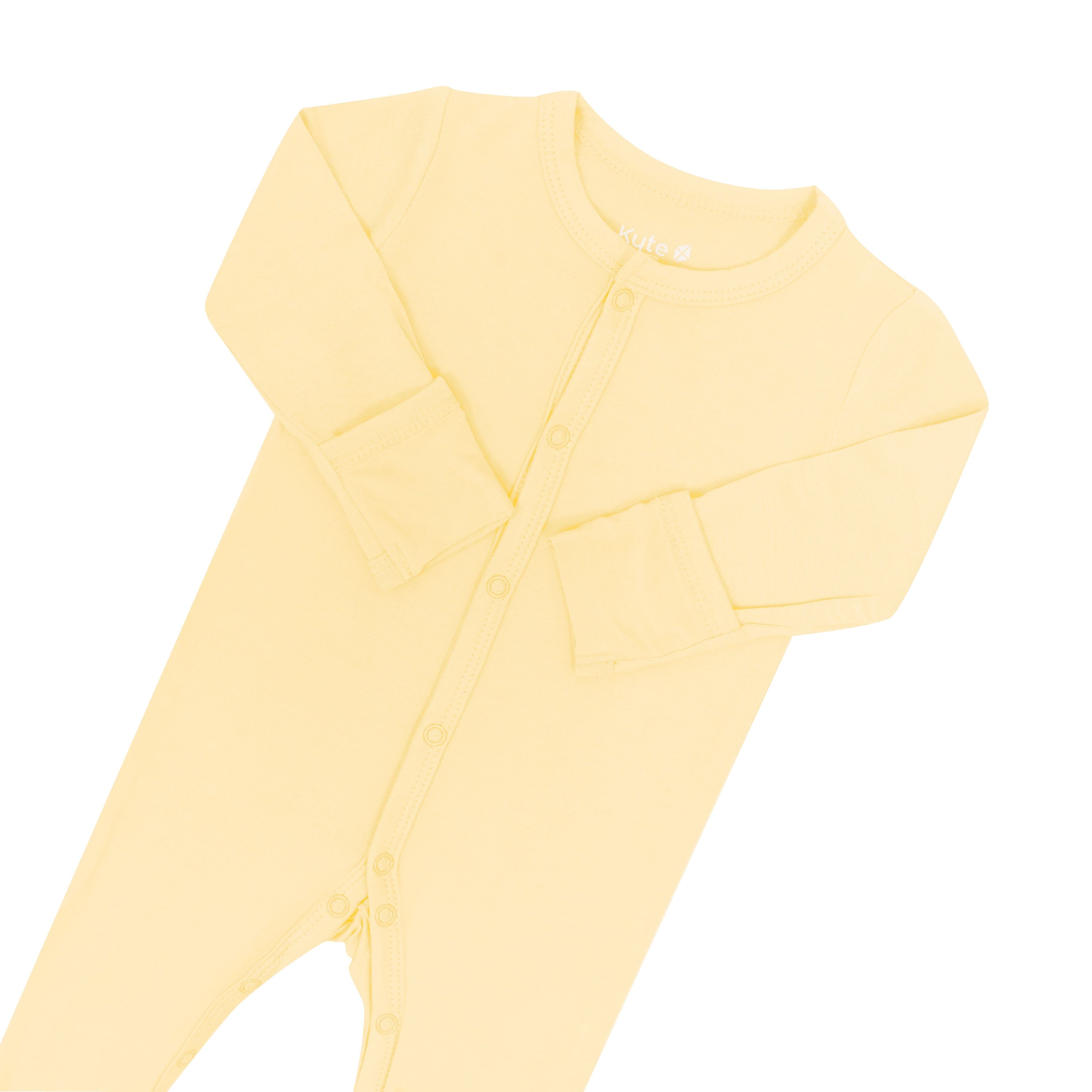 Foldable mittens and snaps on yellow footie pajamas