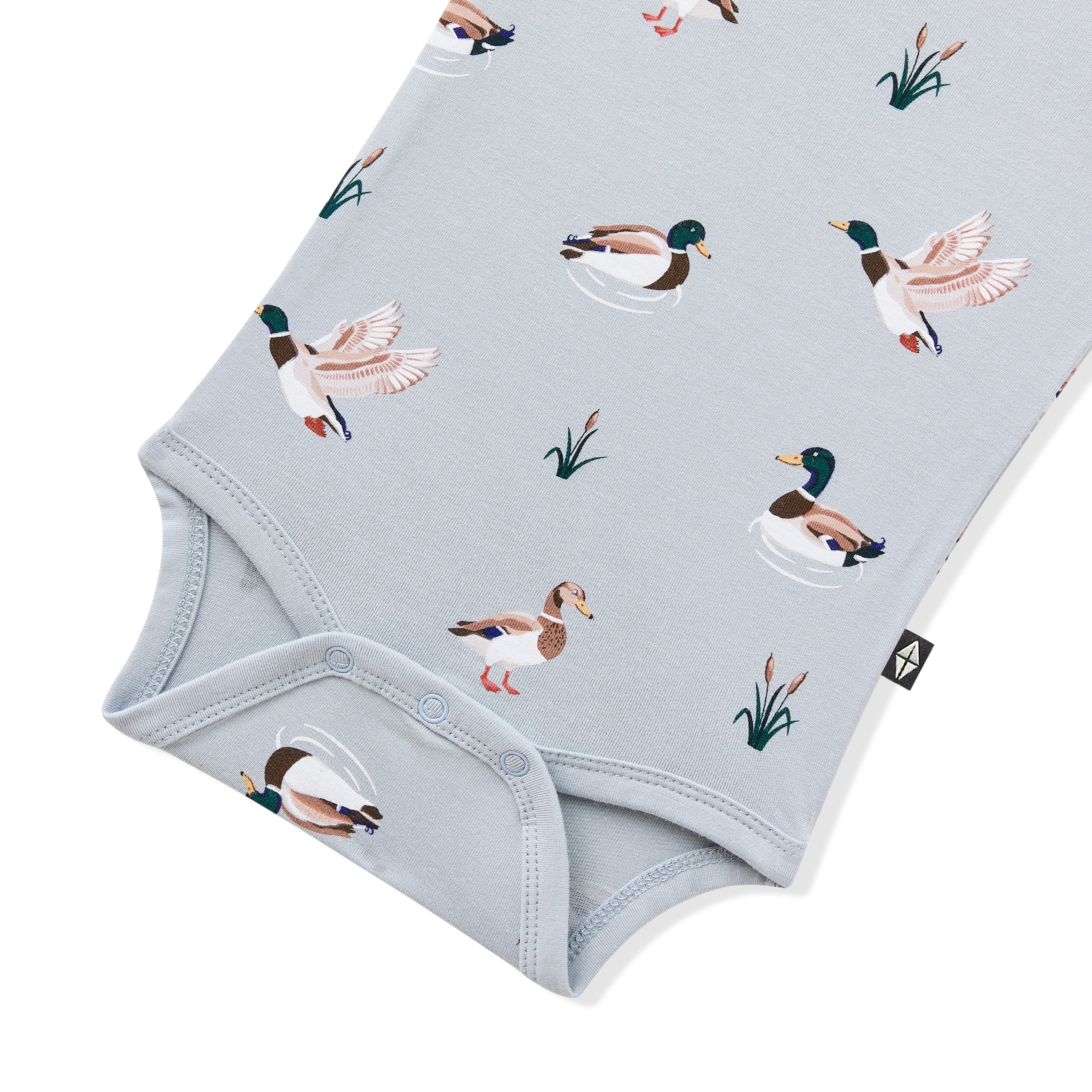 Close up of the snap closures shown on the Bodysuit in Mallard Duck