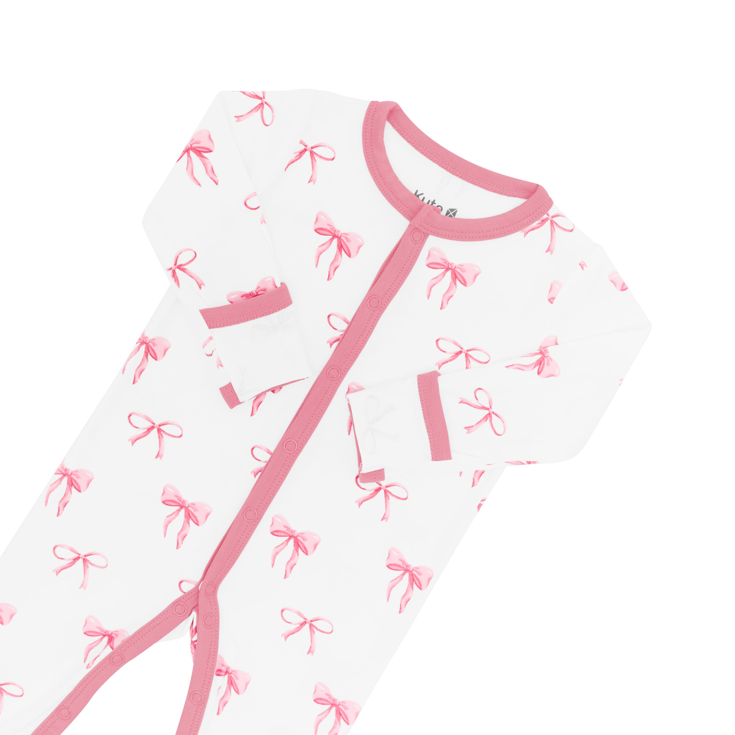 Close up of snap closures and Apple Blossom trim on the Romper in Bow