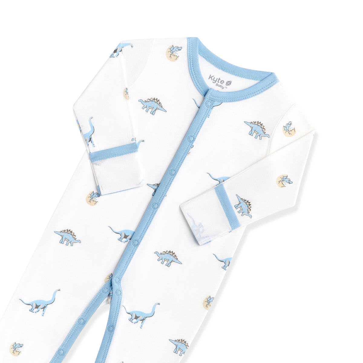 Close up of the snap closures and fold over hand cuffs on the Romper in Jurassic