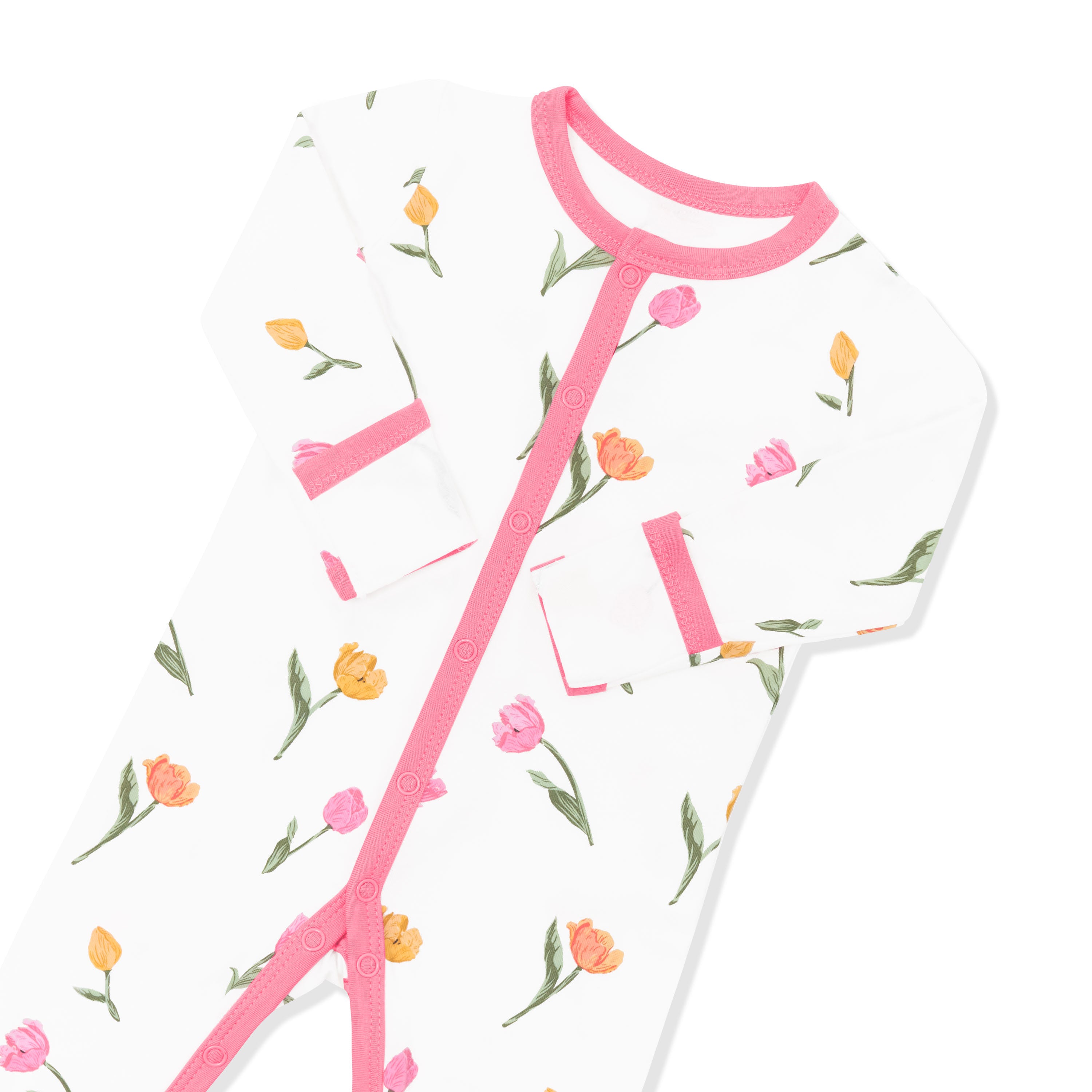 Close up of the pink colored snap trim with the fold over hand cuffs shown on the Romper in Tulip