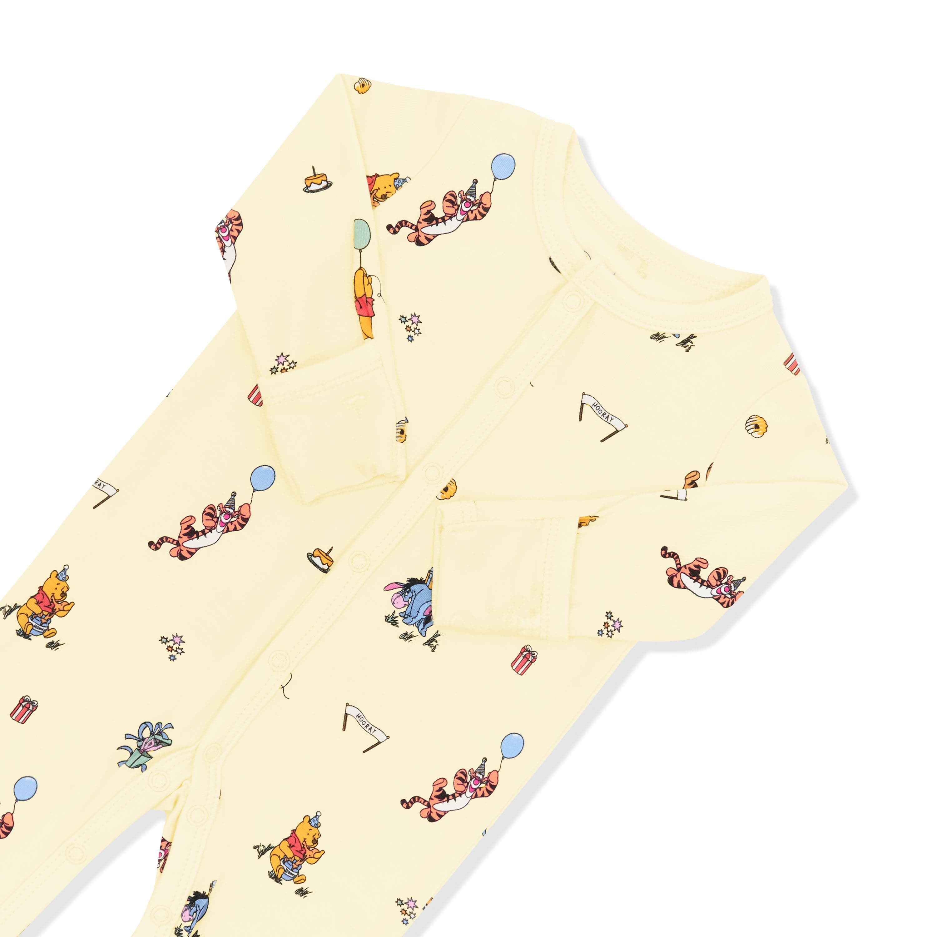 Close up of the snap closures and fold over hand cuffs on the Romper in Winnie the Pooh Celebration