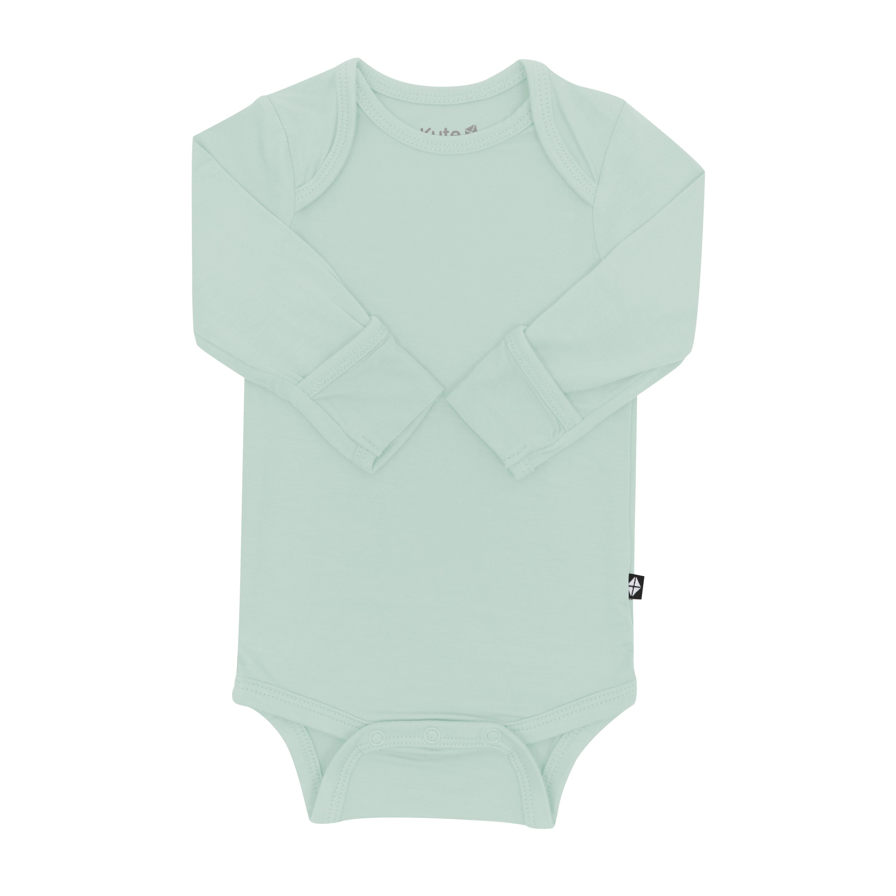 Flat lay of layered Kyte Baby Long Sleeve Bodysuit in Sage with arms folded inwards and fold-over cuffs displayed