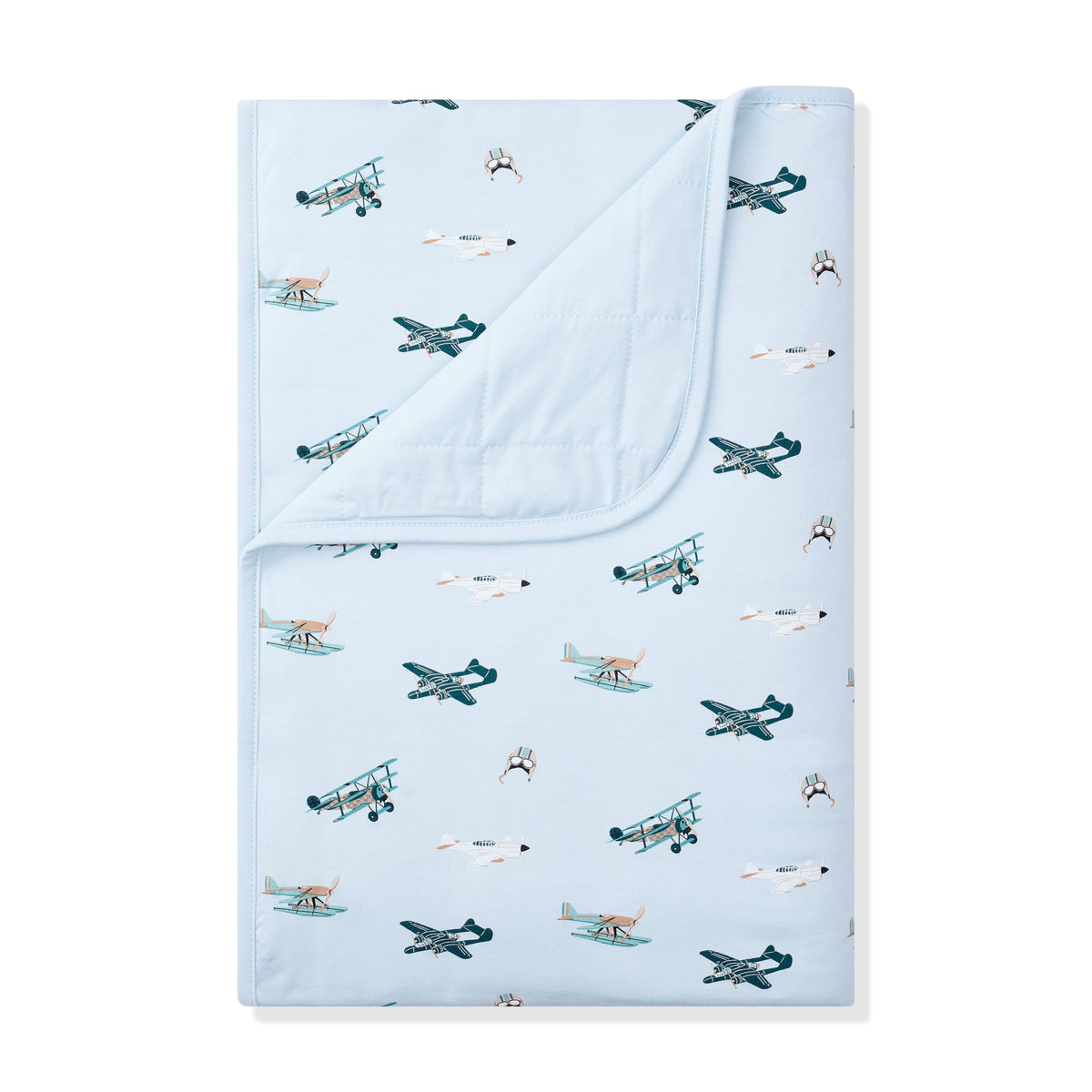 Toddler Blanket in Take Off 1.0 with the corner folded down showing the light blue backing