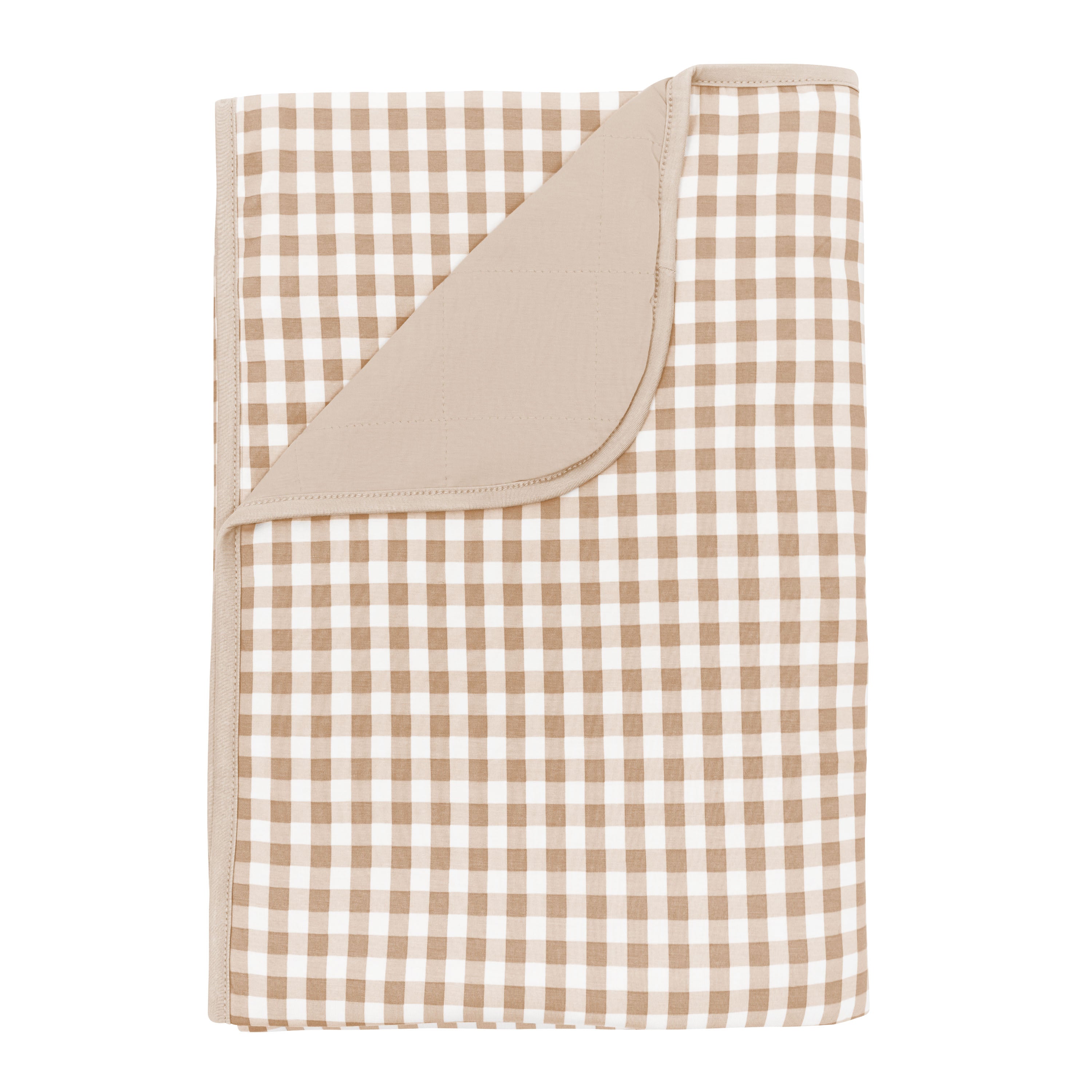 Toddler Blanket in Gingham Bisque 1.0 with corner flipped down showing the Bisque colored backing