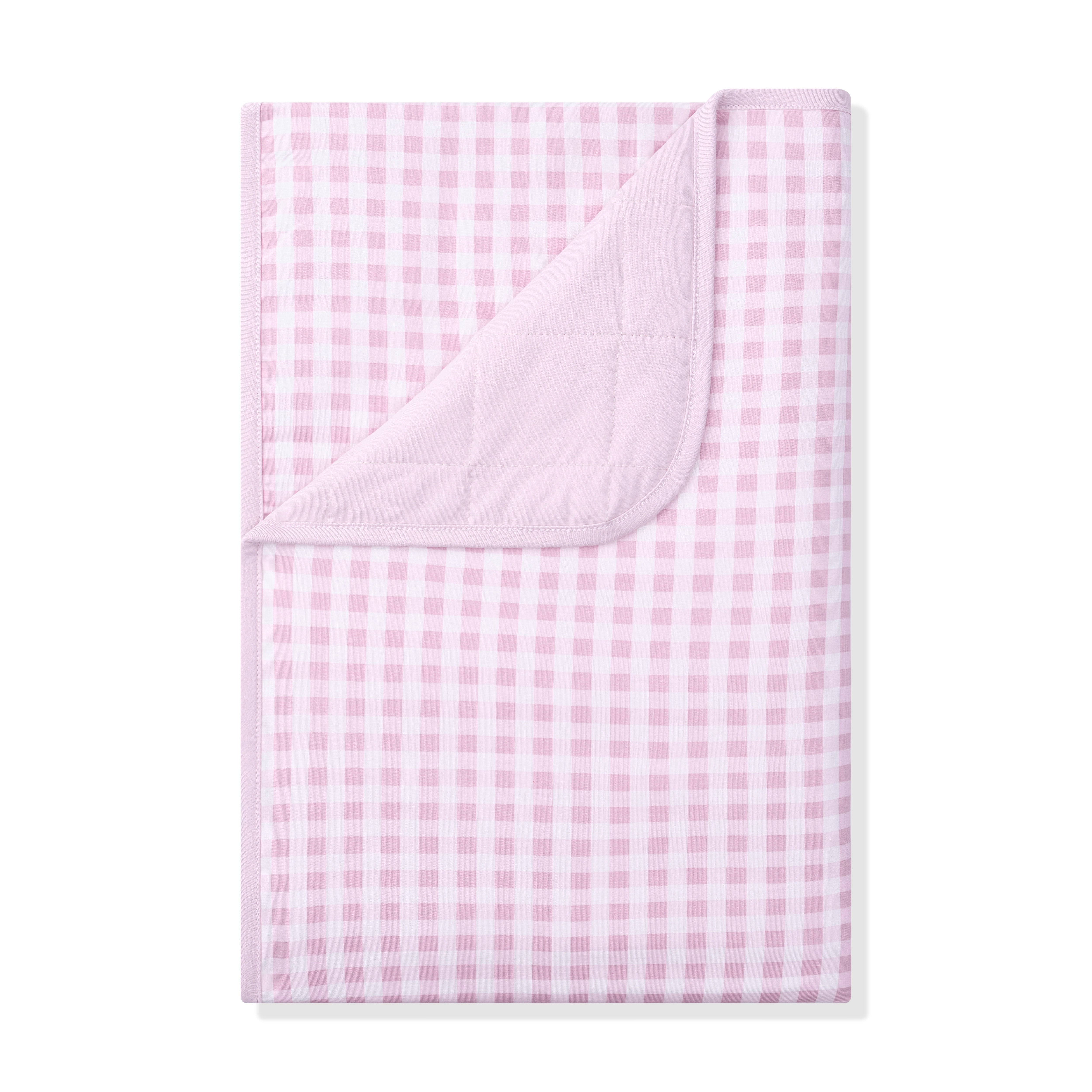 Toddler Blanket in Gingham Thistle 1.0 with the corner flipped down showing the light purple quilted backing