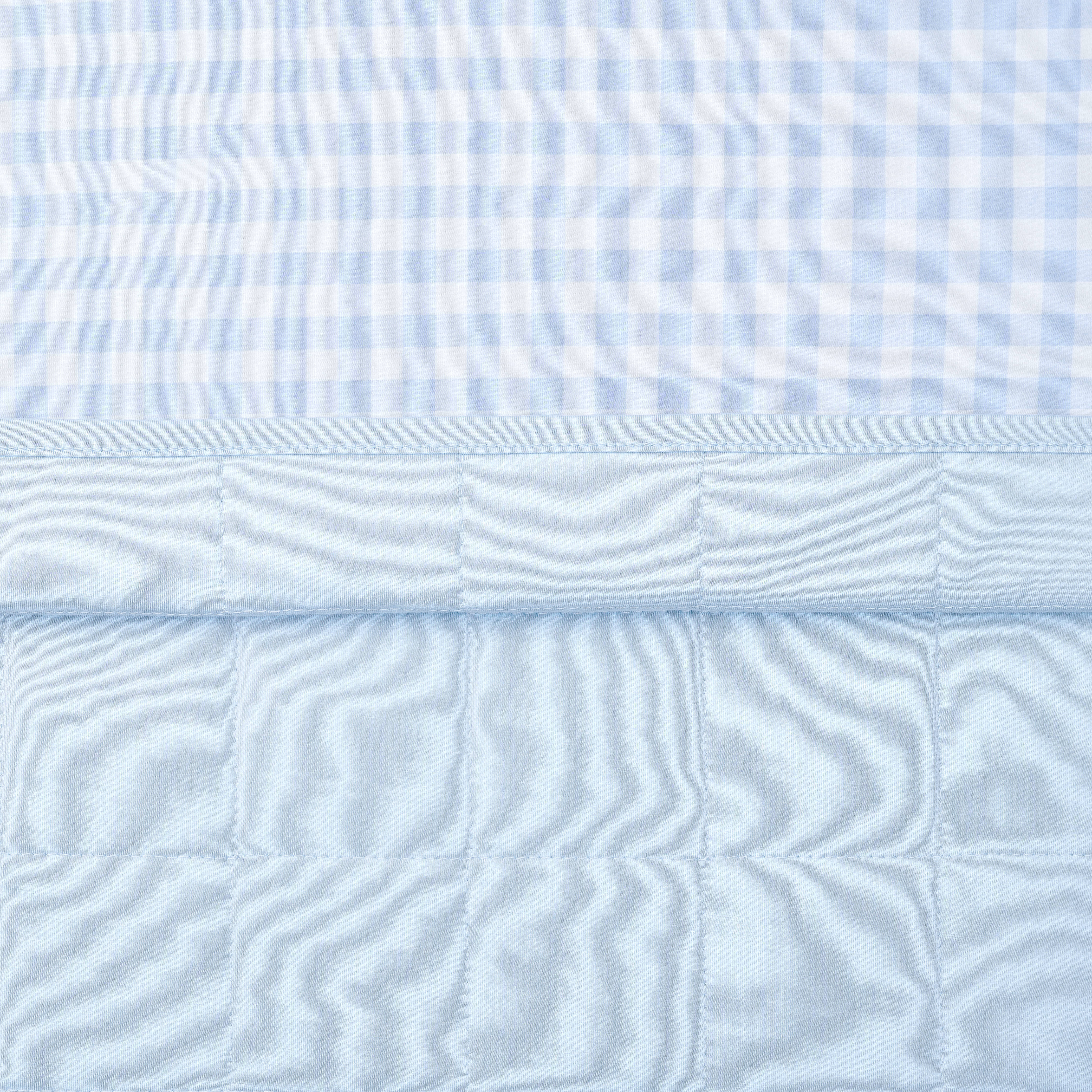 Close up of the quilted backing and smooth top patterned layer of the Toddler Blanket in Gingham Breeze 1.0