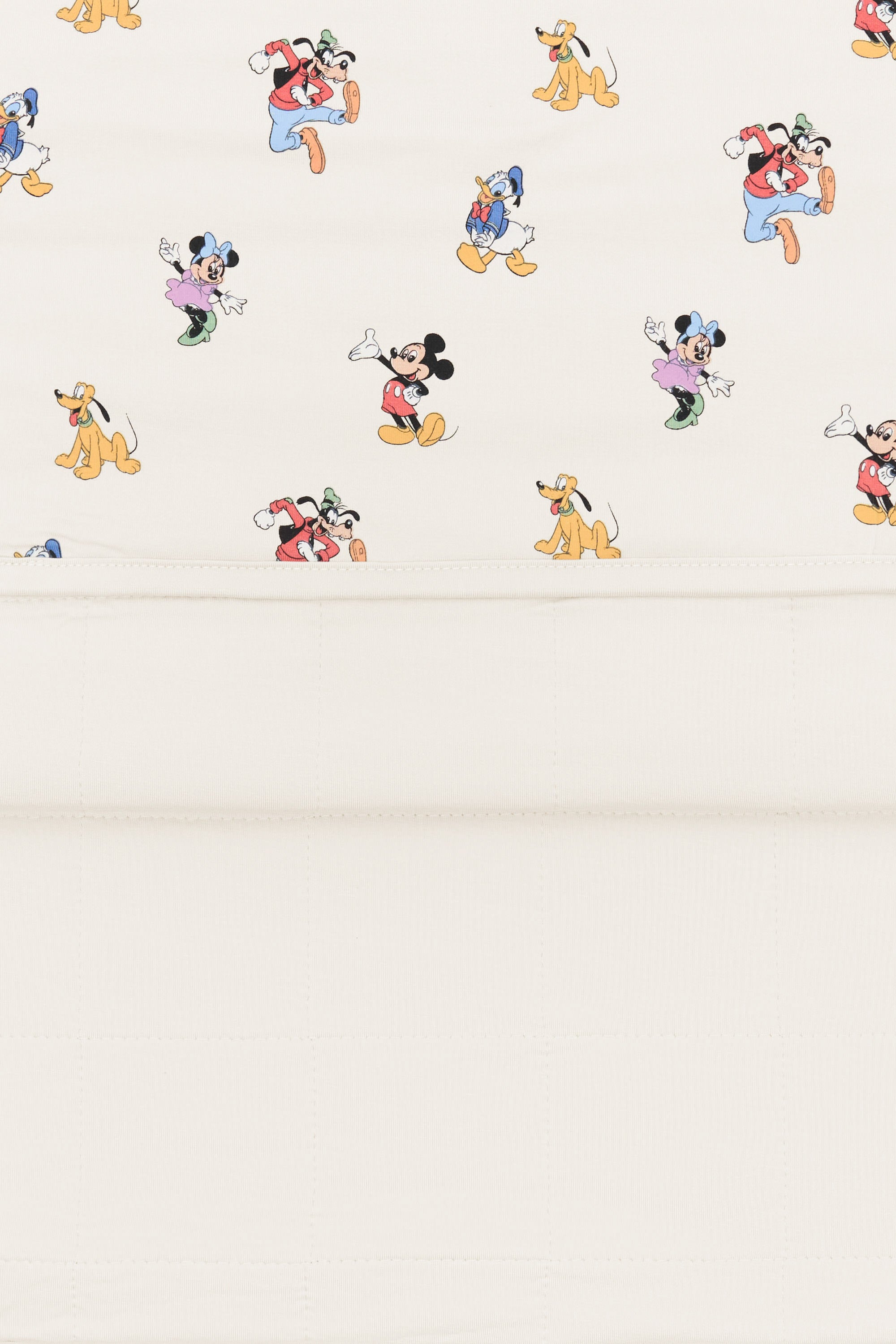 Back side fabric of Toddler Blanket in Mickey Mouse and Friends print on an oat background