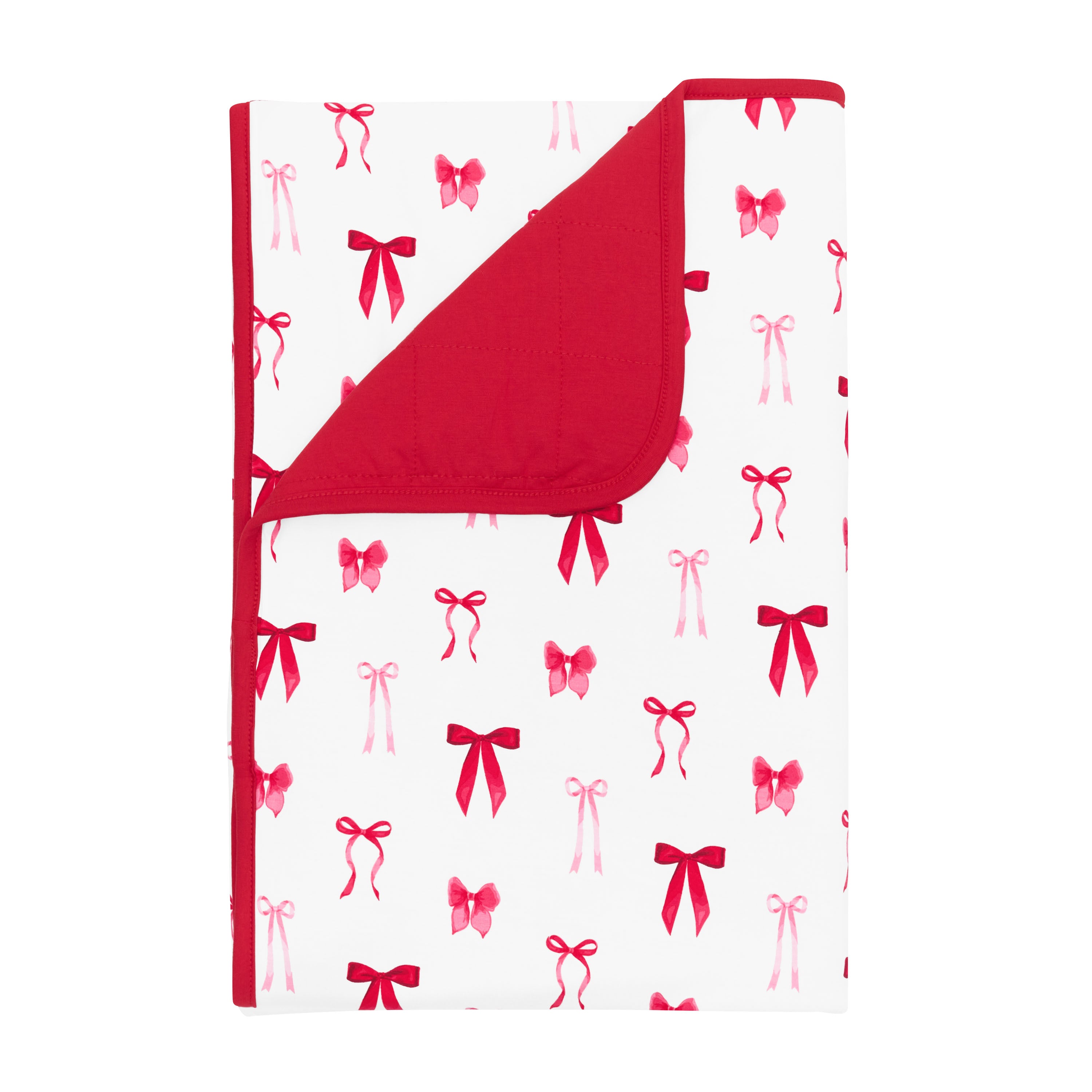 Product photo of the Toddler Blanket in Small Love Bow 1.0 with the corner flipped down showing the red backing