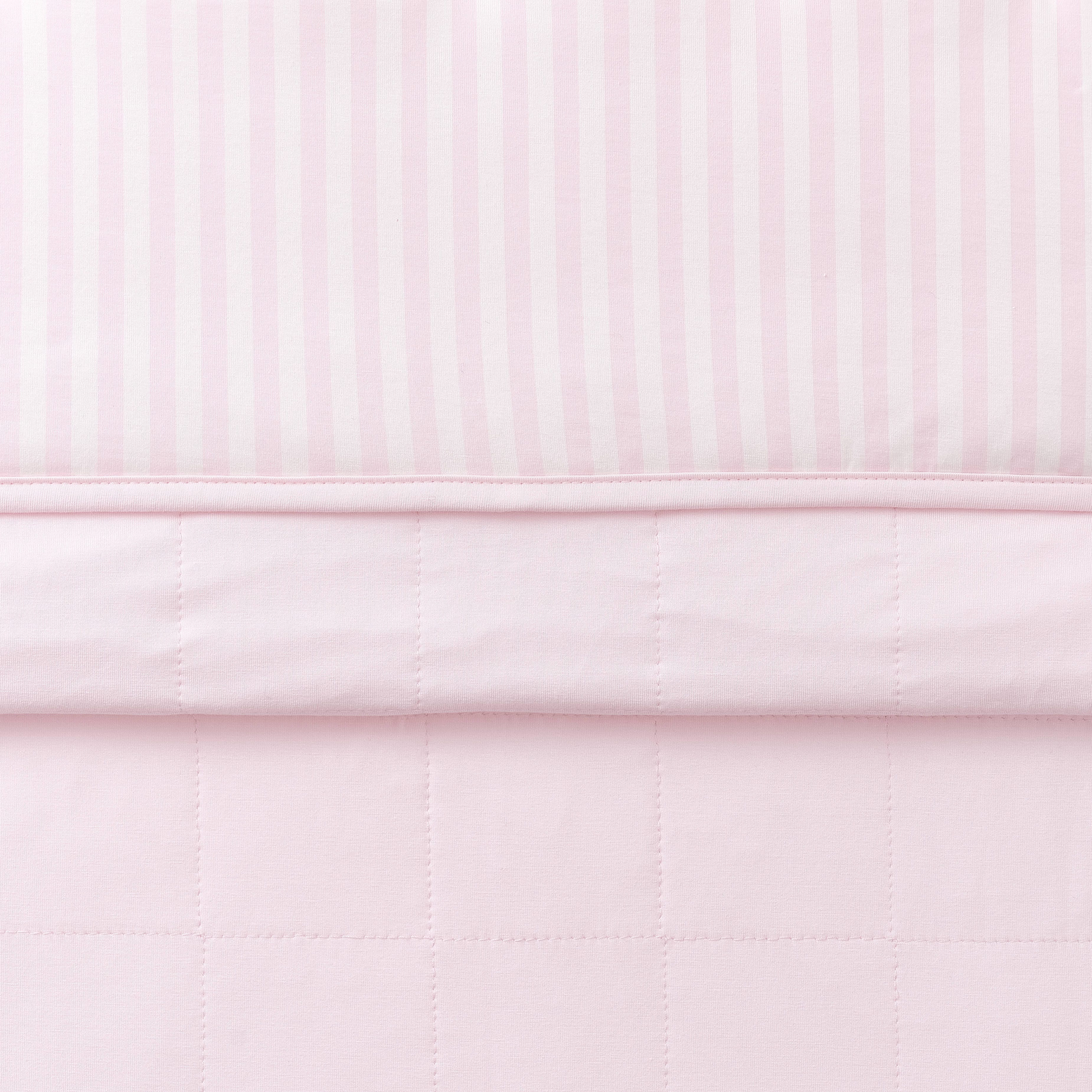 Toddler Blanket in Small Sakura Stripe 1.0 folded showing the quilted detail on the back of the blanket and the print detail on the front