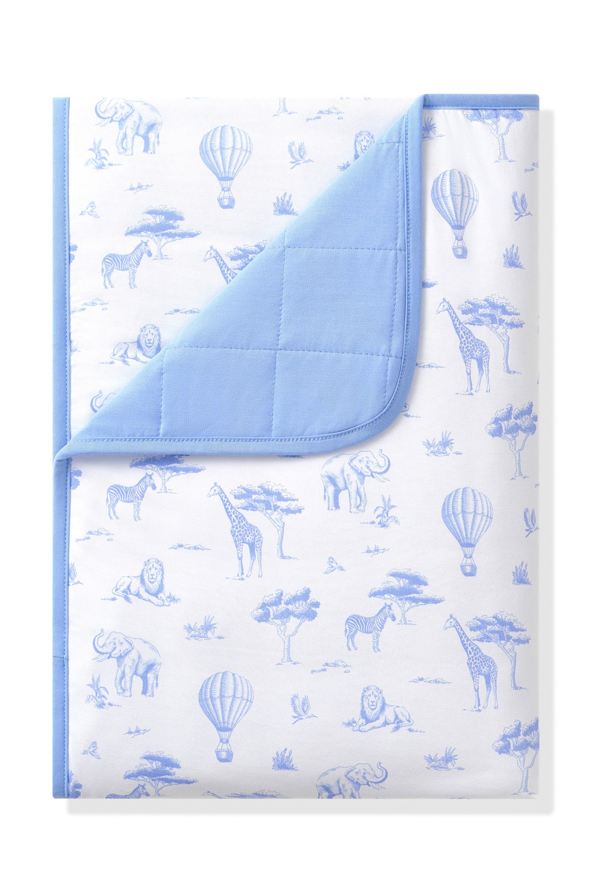 Toddler Blanket in Toile Safari 1.0 with the corner folded down showing the blue backing