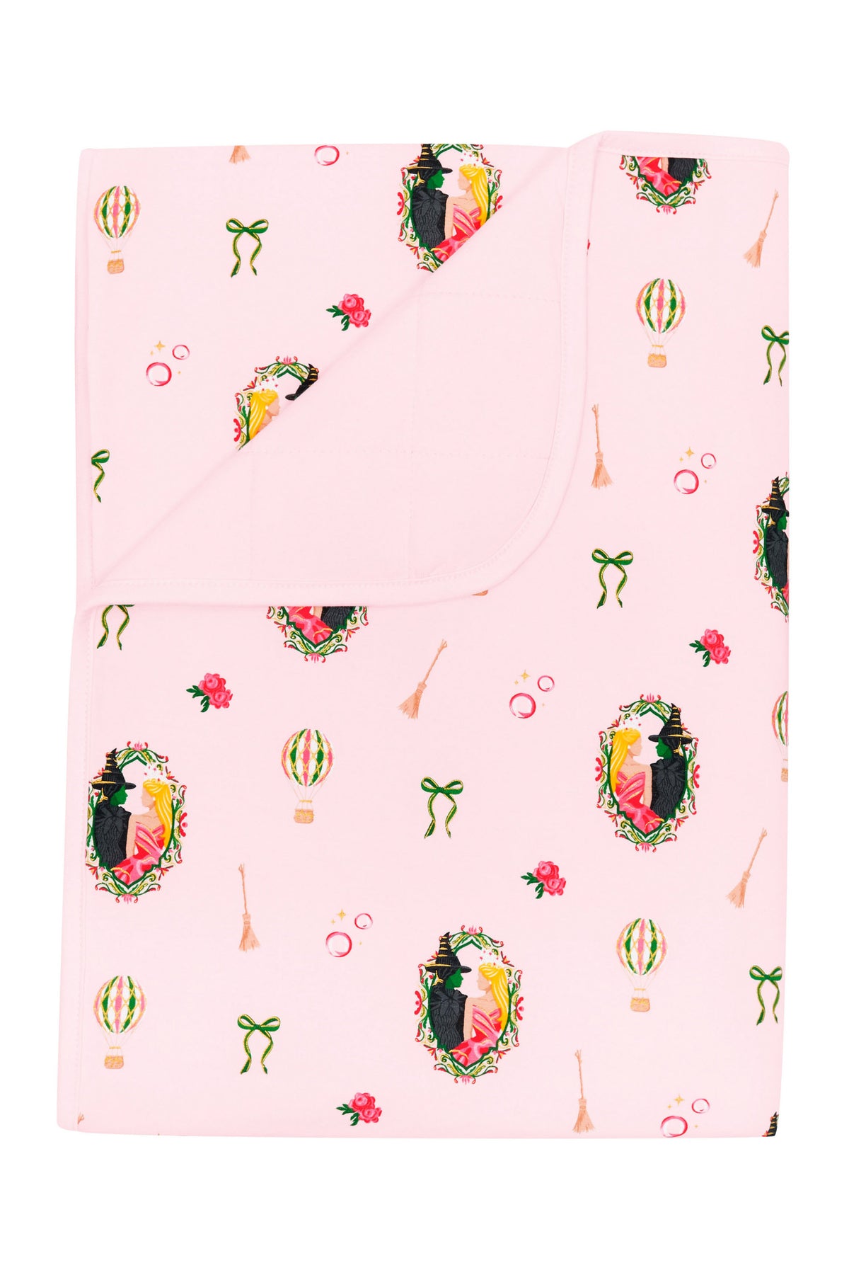 Toddler Blanket in Wicked 1.0 with the corner flipped down showing the light pink backing