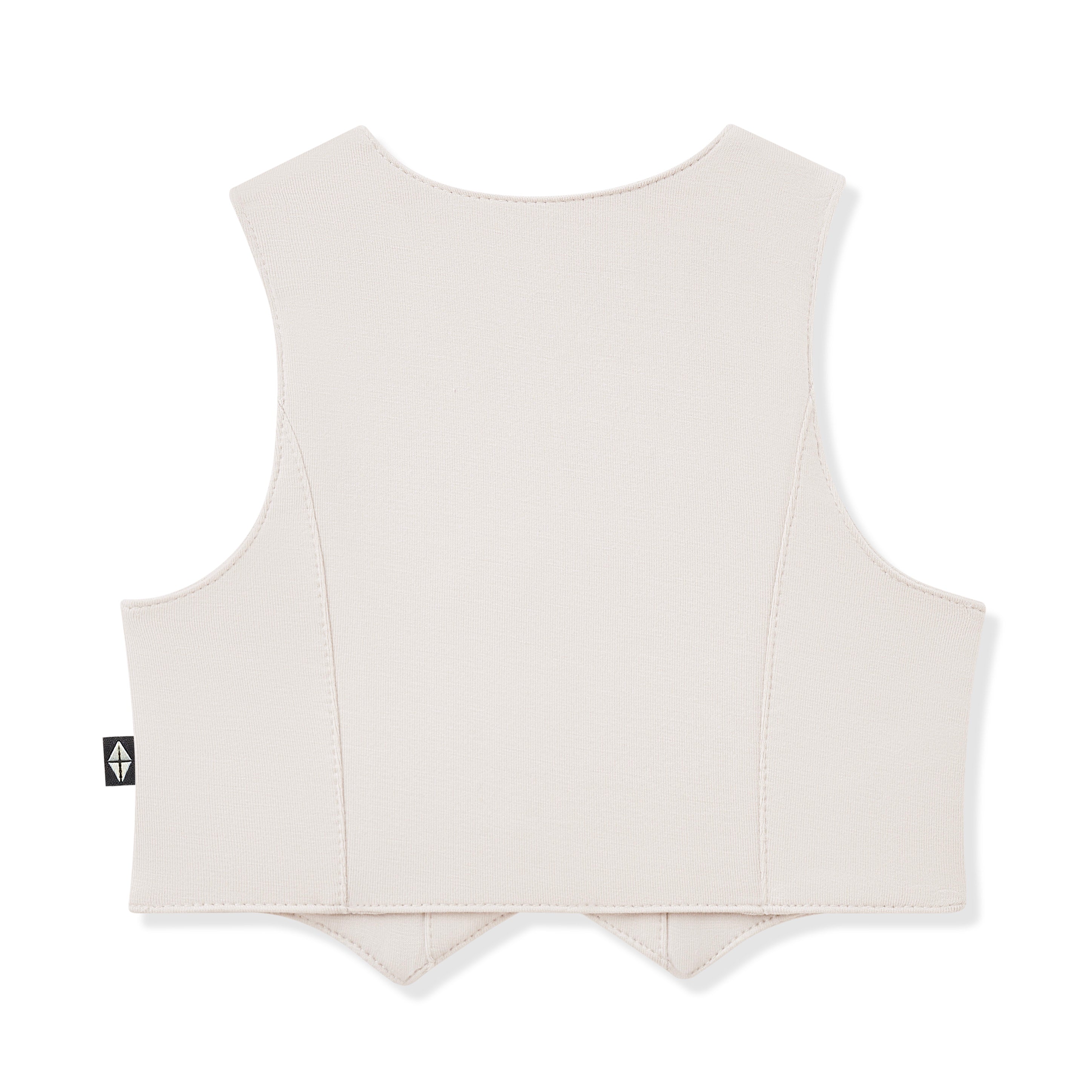 Cream vest with a small logo on the back against a white background
