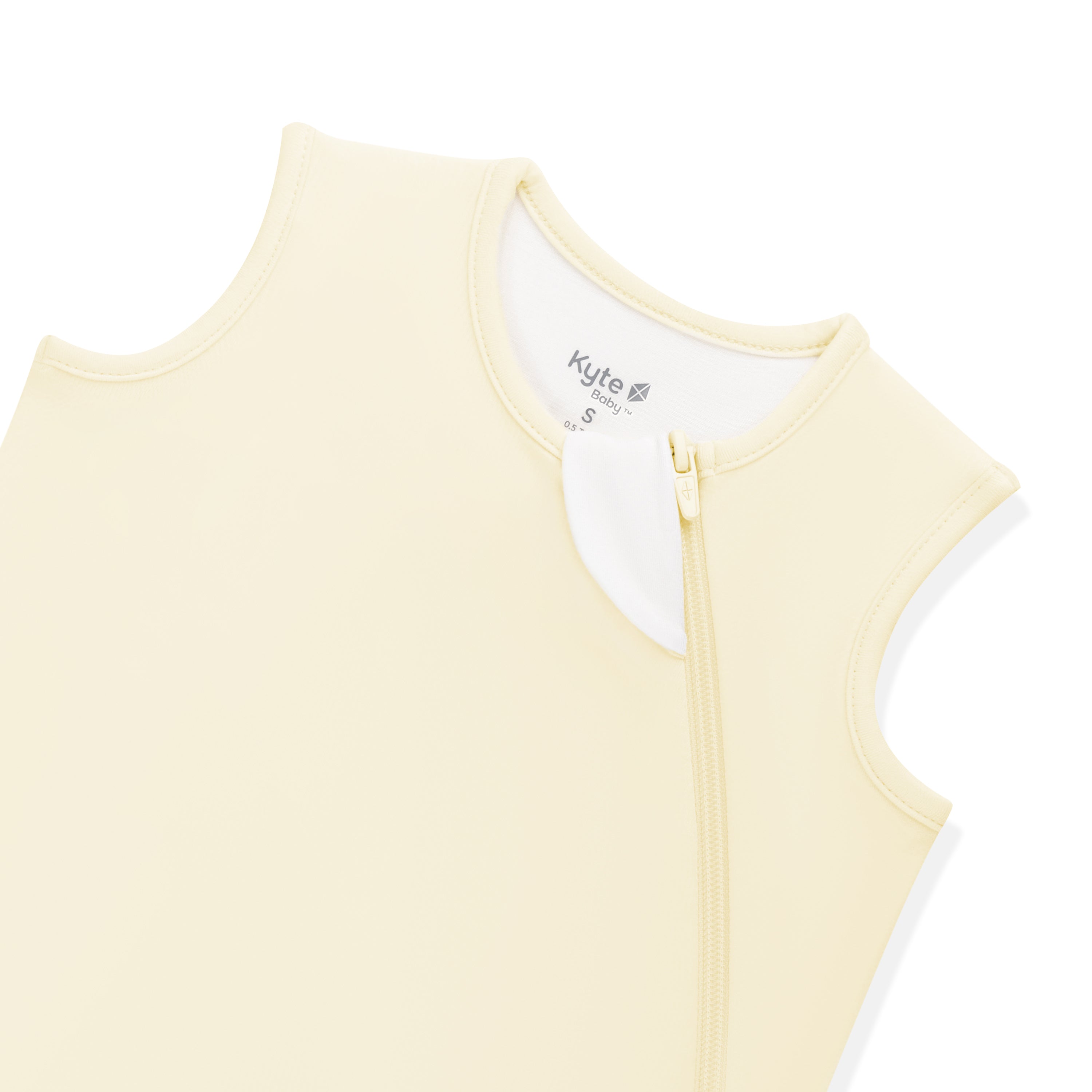 Close up of the zipper garage and top zipper shown on the Sleep Bag in Chamomile 0.5