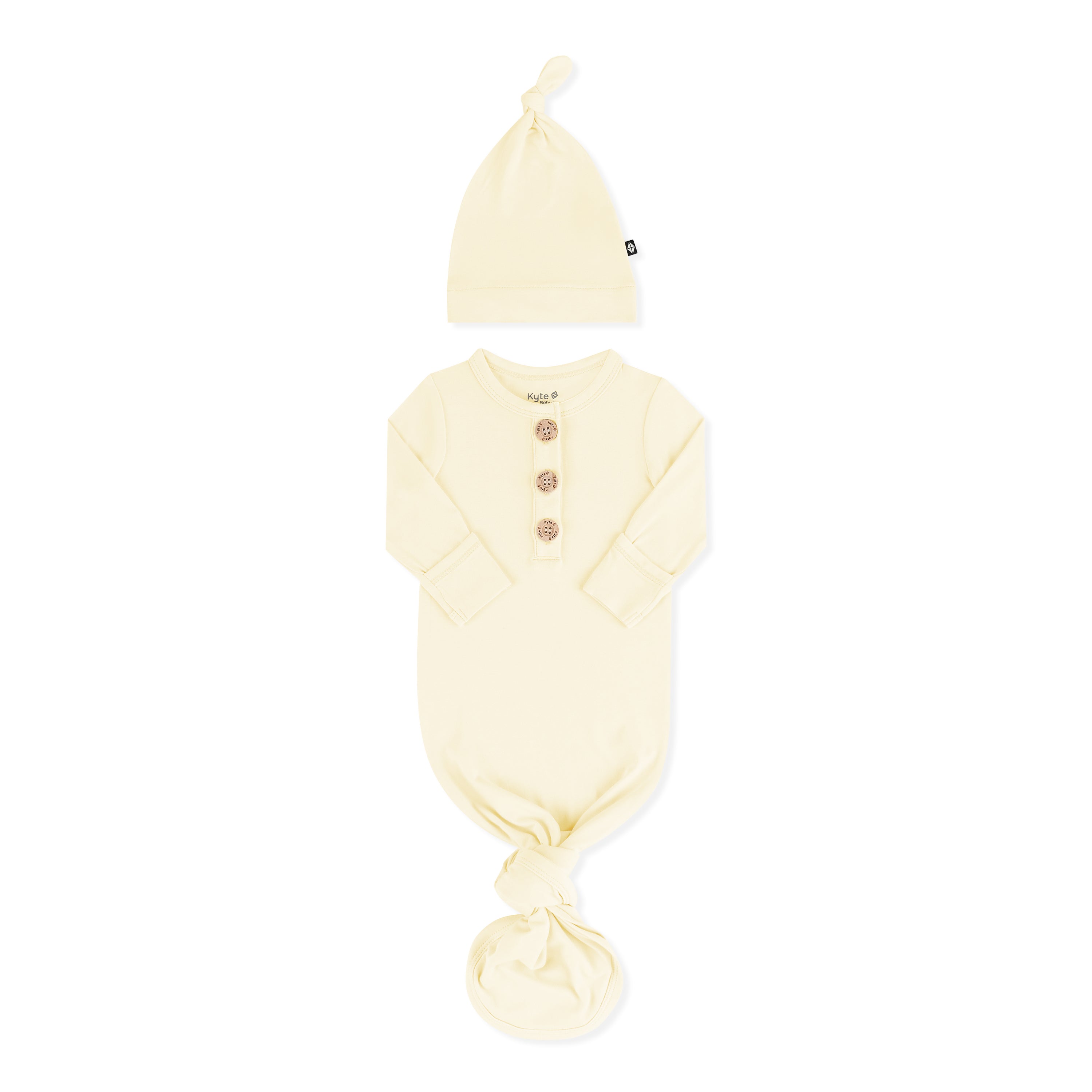 Knotted Gown with Hat Set in Chamomile with the arms folded inward