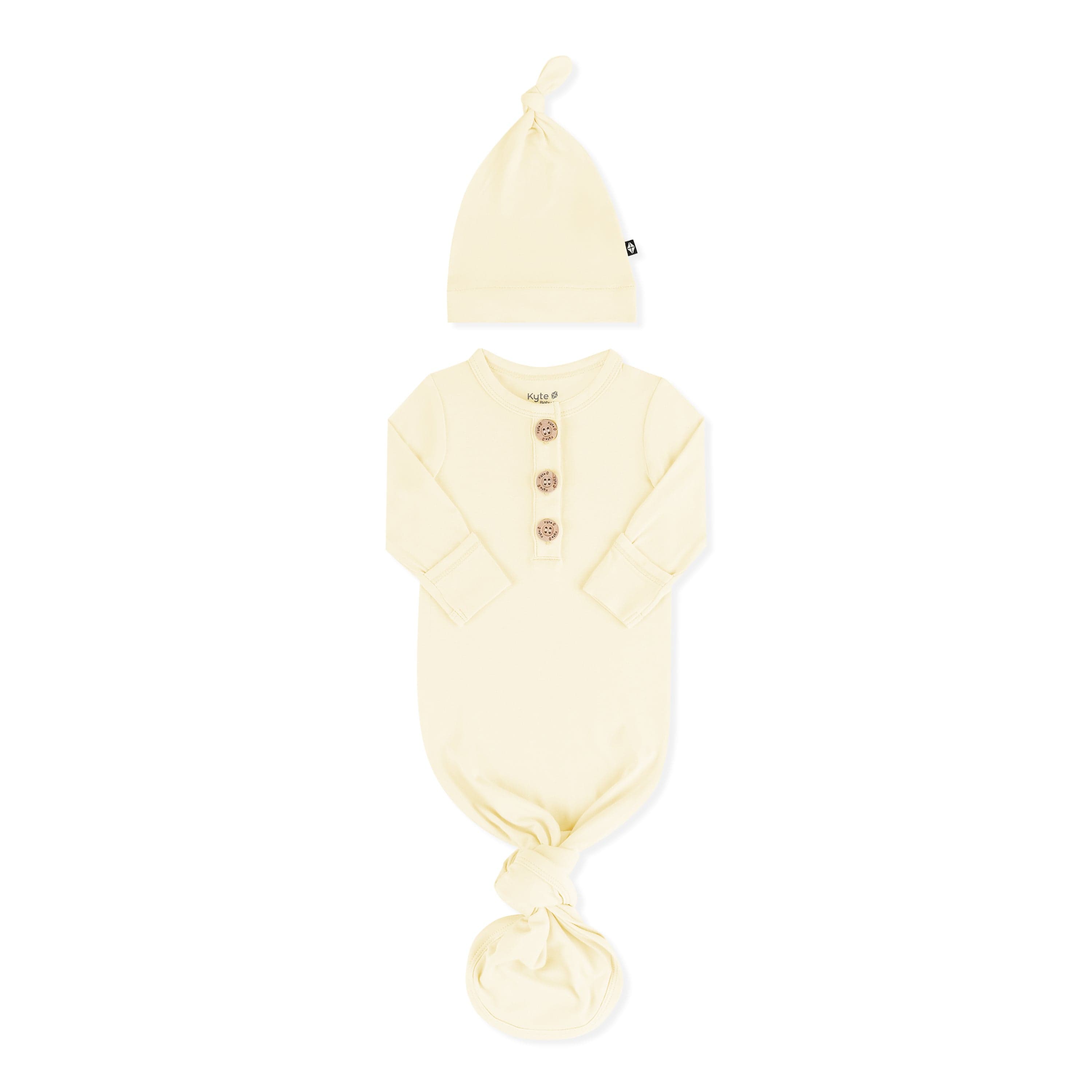 Knotted Gown with Hat Set in Chamomile with the arms folded inward