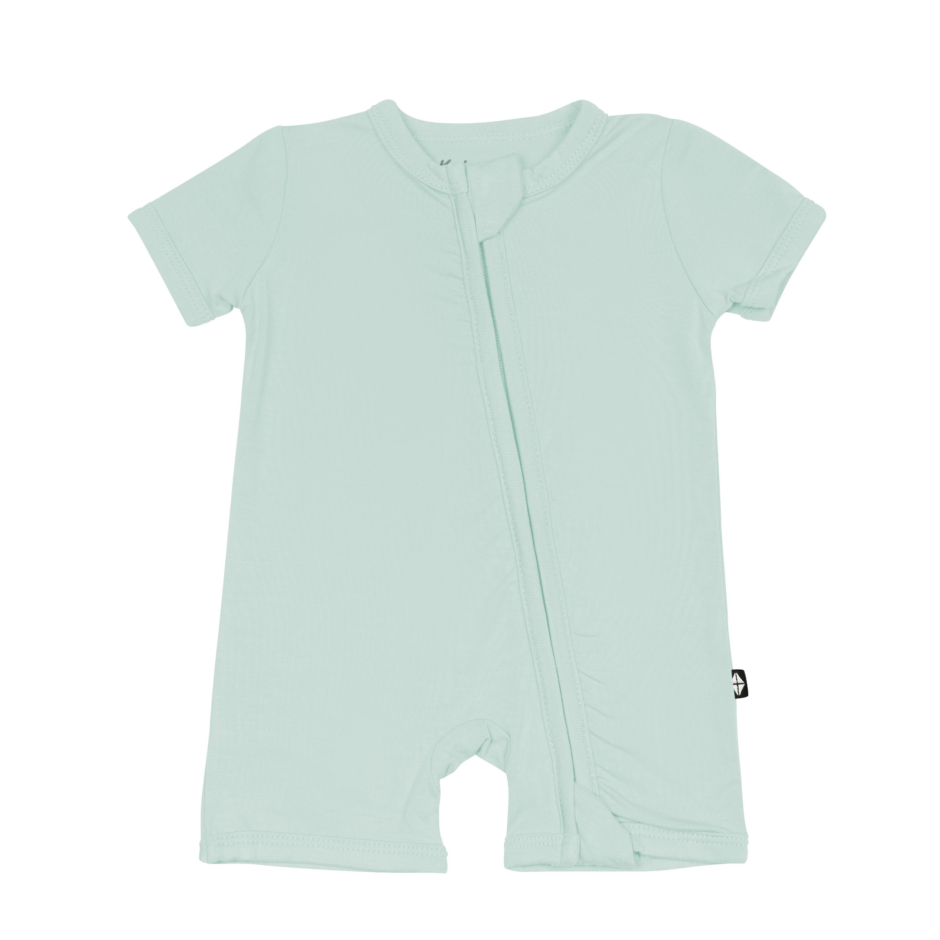 Flat lay of Kyte Baby Zippered Shortall Romper in Sage