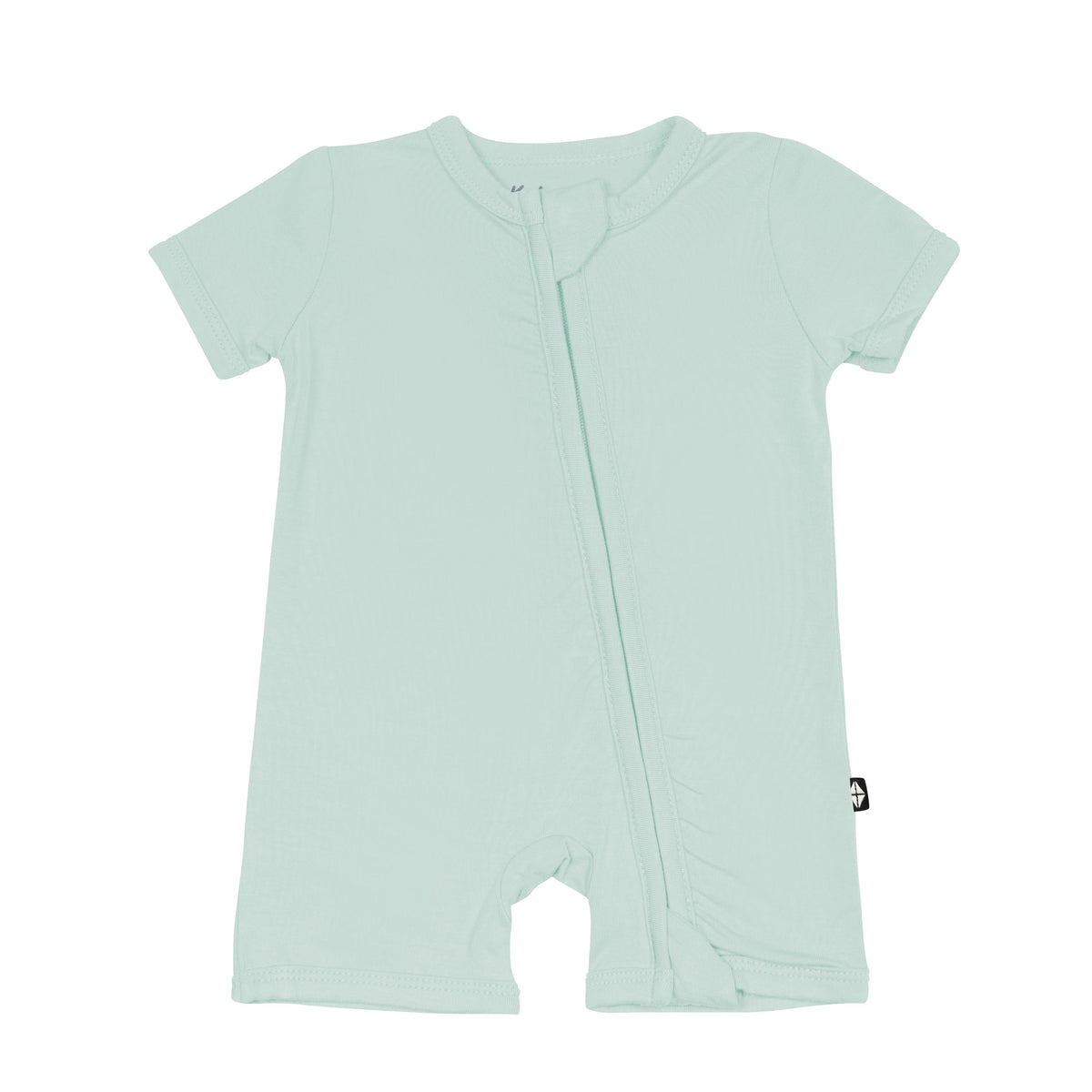 Flat lay of Kyte Baby Zippered Shortall Romper in Sage