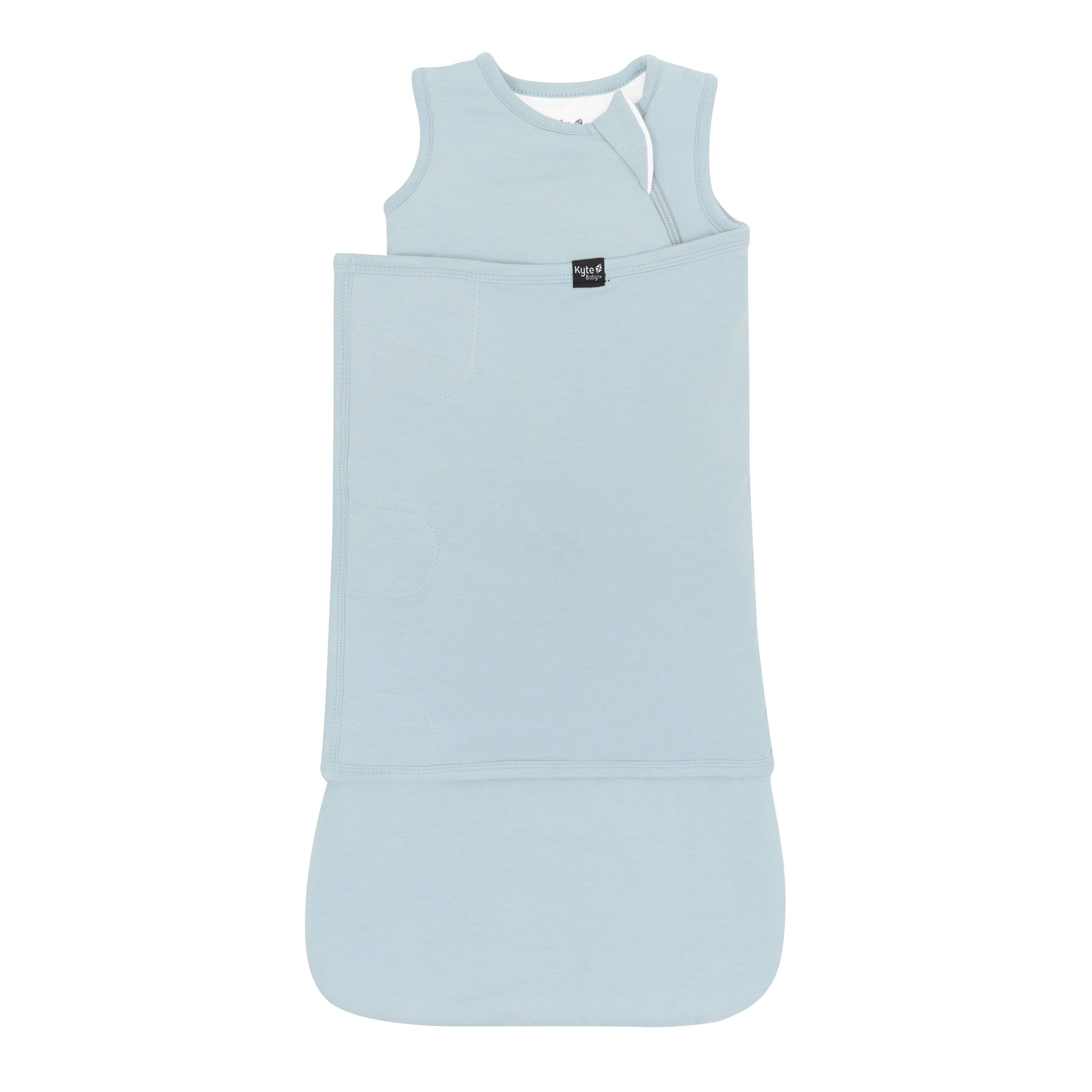 Sleep Bag Swaddler in Fog 1.0 shown swaddled with the Black Kyte Baby logo visible