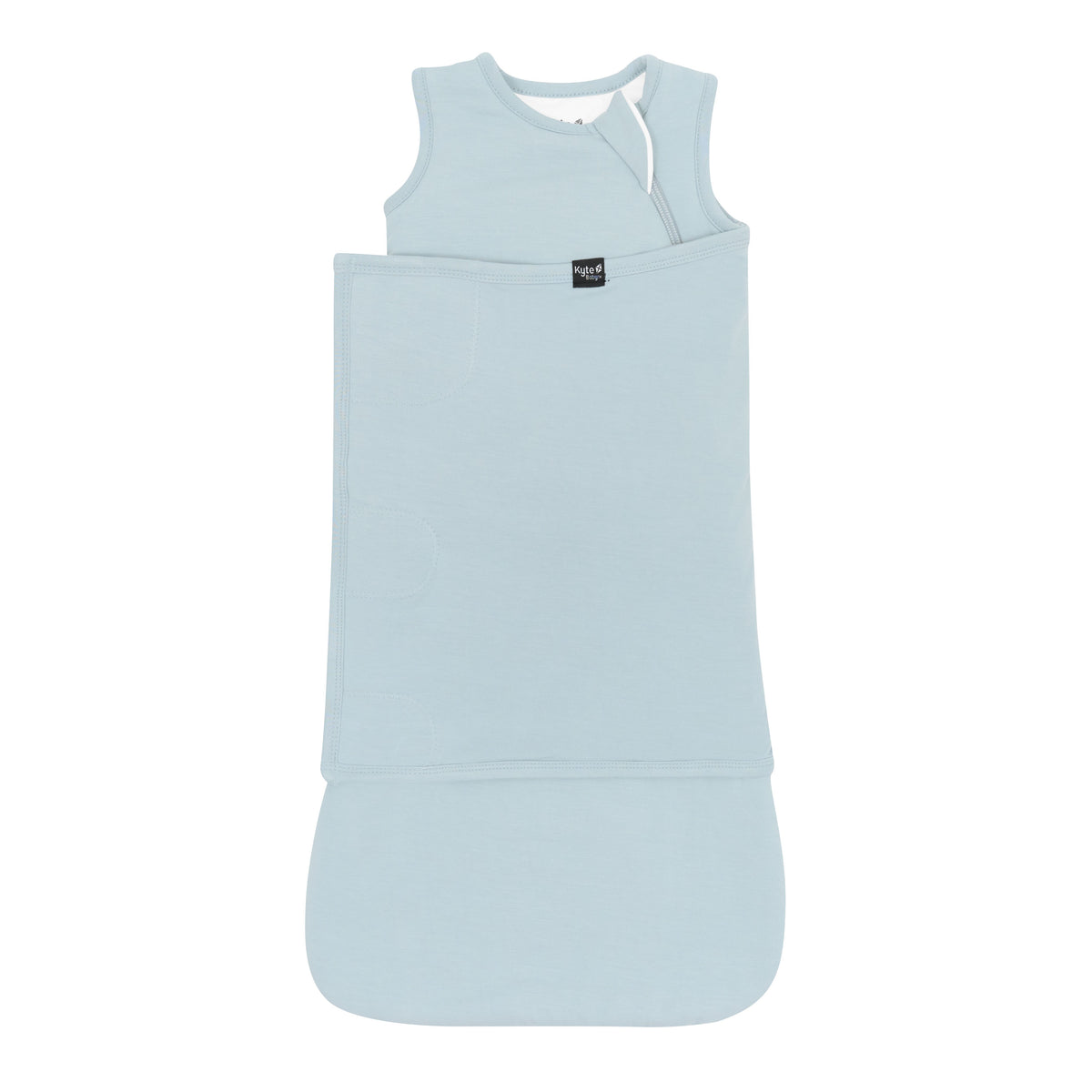 Sleep Bag Swaddler in Fog 1.0 shown swaddled with the Black Kyte Baby logo visible