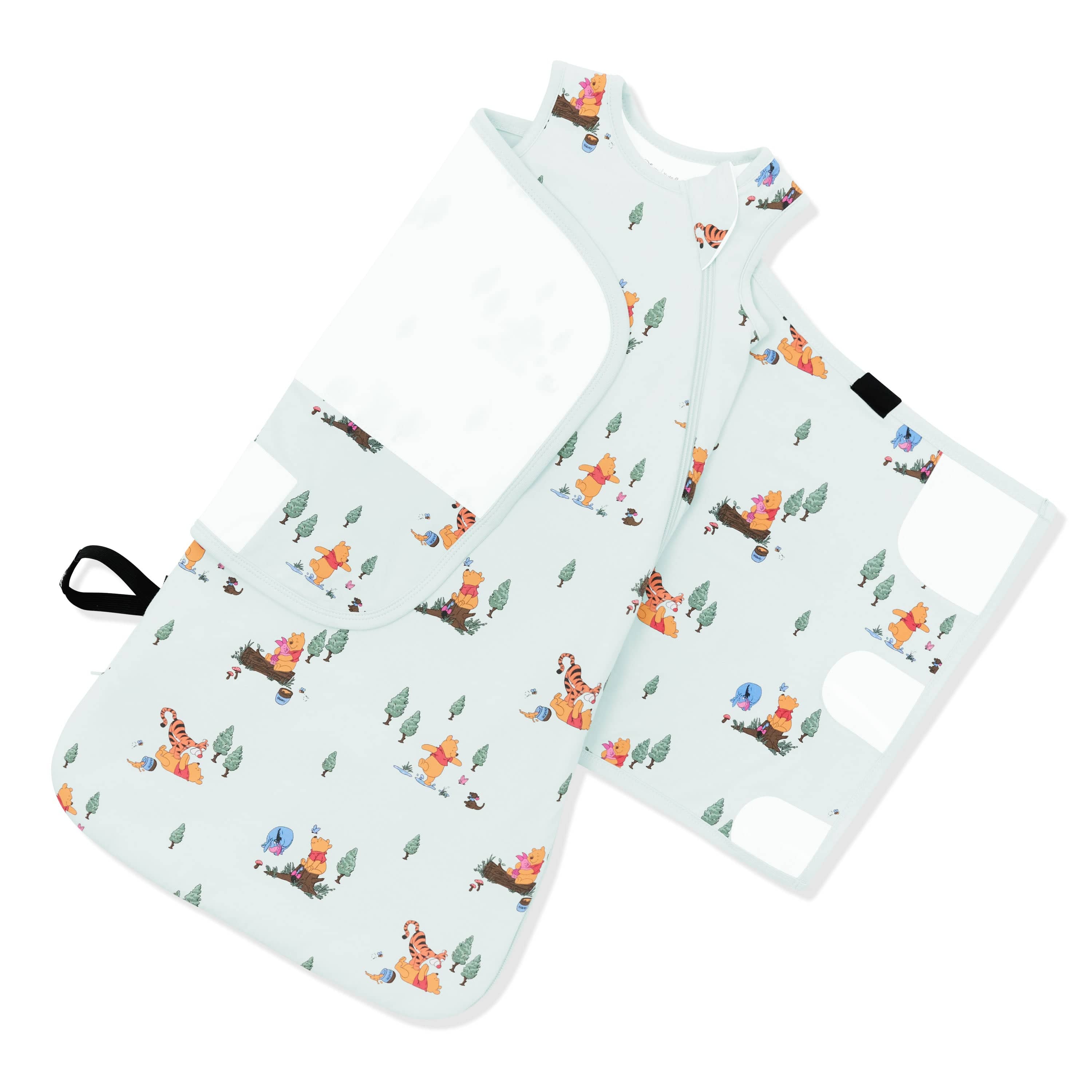 The adjustable swaddle wrap shown on an unswaddled Sleep Bag Swaddler in Winnie the Pooh Hundred Acre Wood 1.0