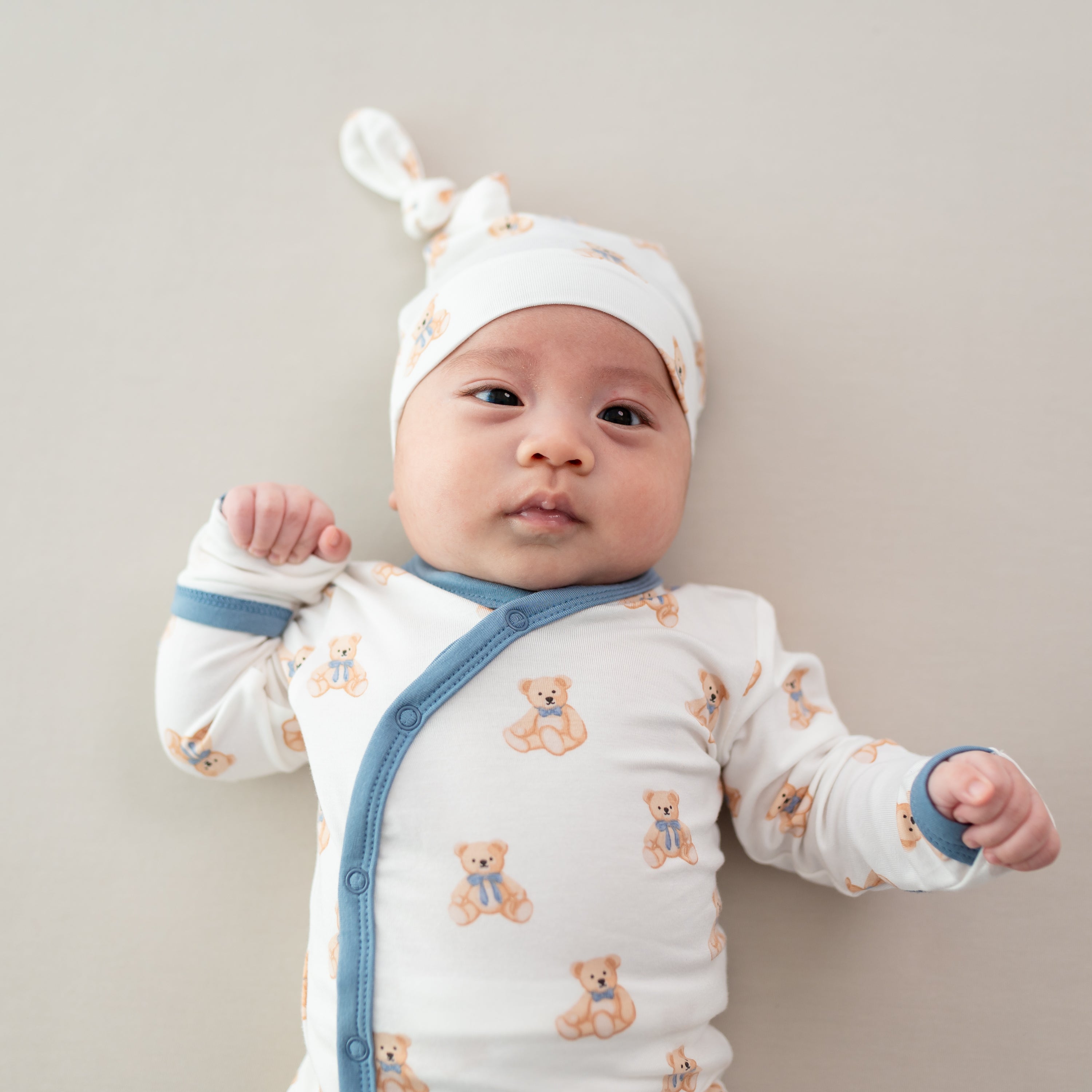 Newborn Wearing Bamboo Take Me Home Set with Cap in Teddy Bear