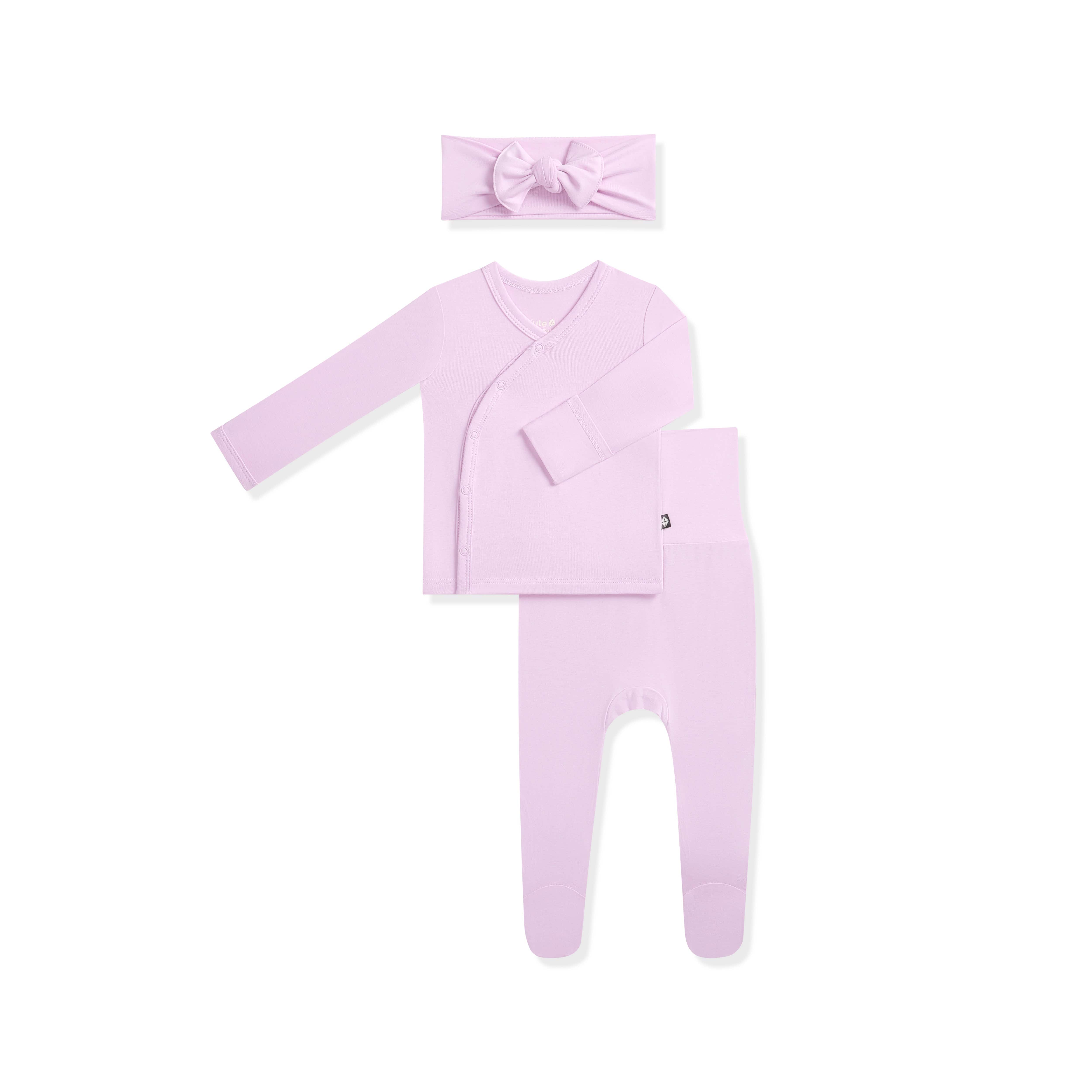 Purple baby clothing set with long-sleeve top, pants, and headband on a white background