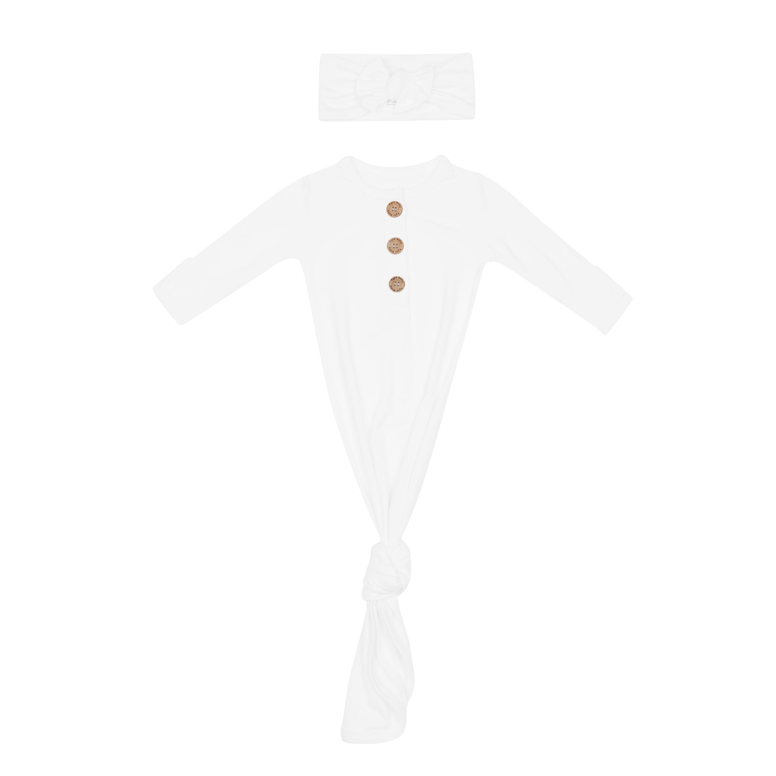 White newborn hospital outfit with knotted gown and bow headband