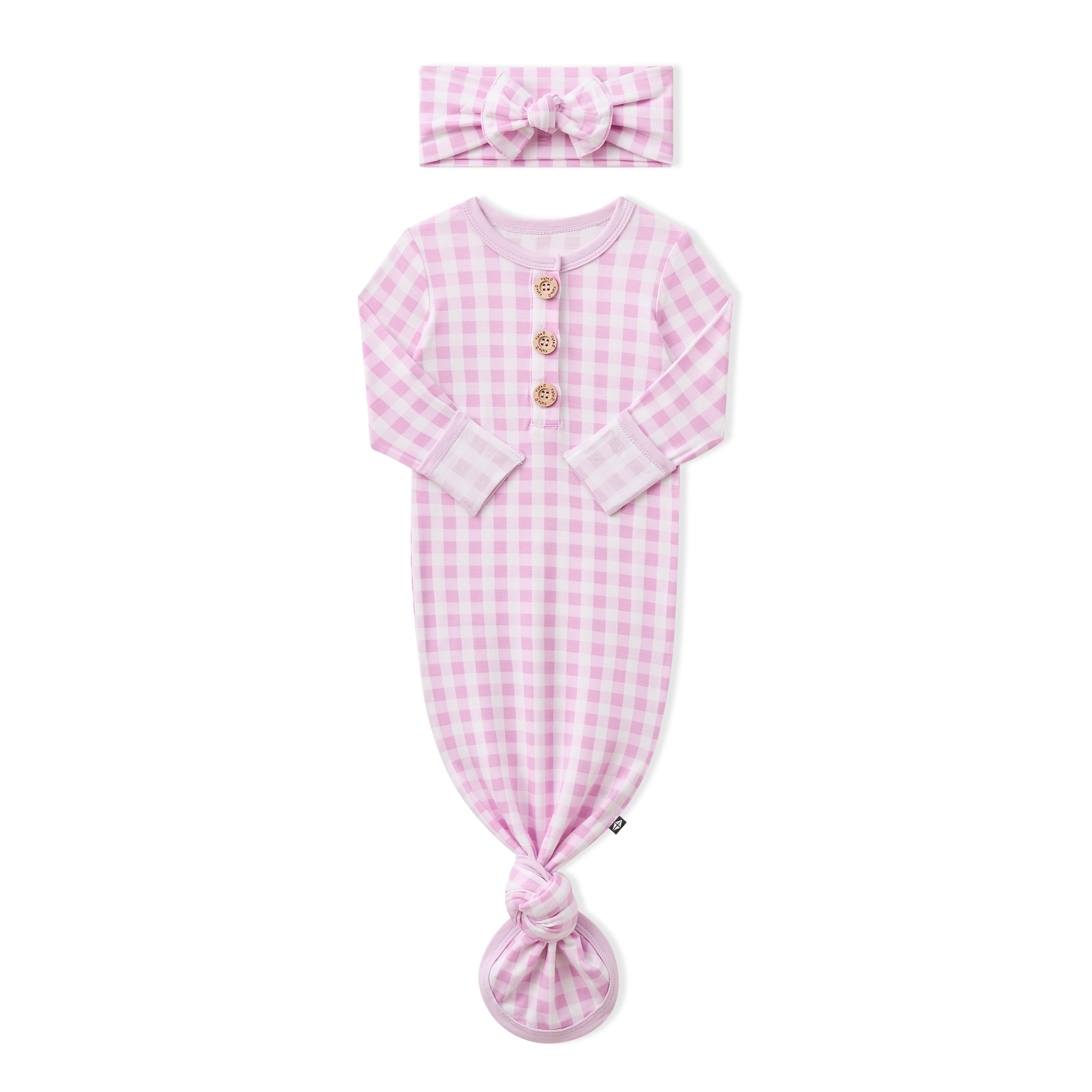Knotted Gown with Bow Set in Gingham Thistle shown with the arms folded inwards on a white surface