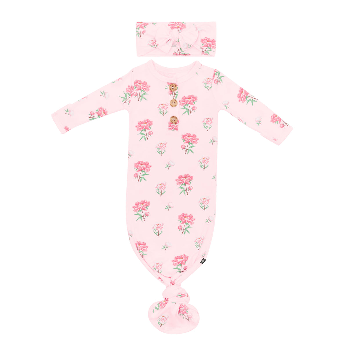 Kyte Baby's Knotted Gown with Bow Set in Sakura Peony with arms laid out flat