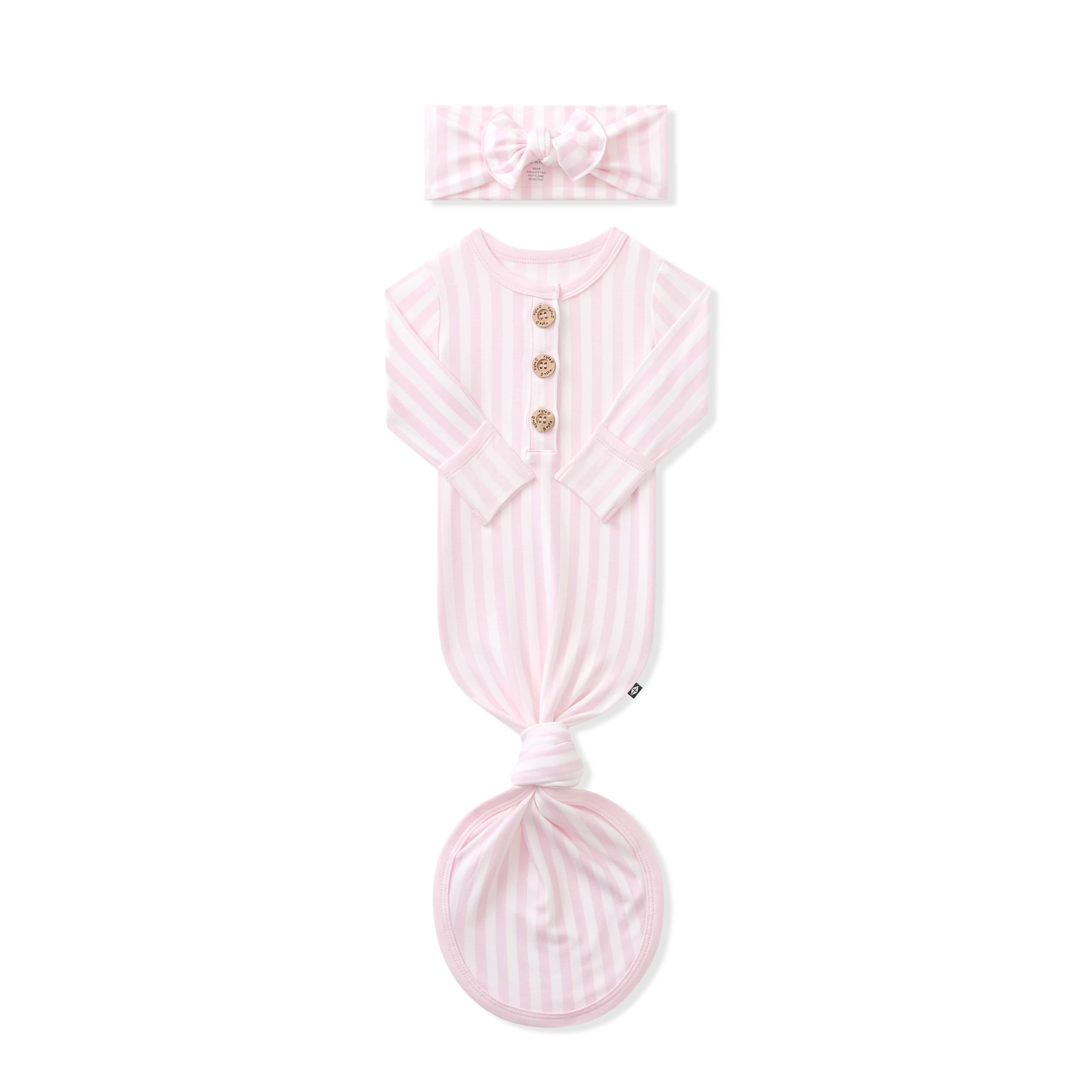 Knotted Gown with Bow Set in Small Sakura Stripe shown with the arms folded in laying on a white background