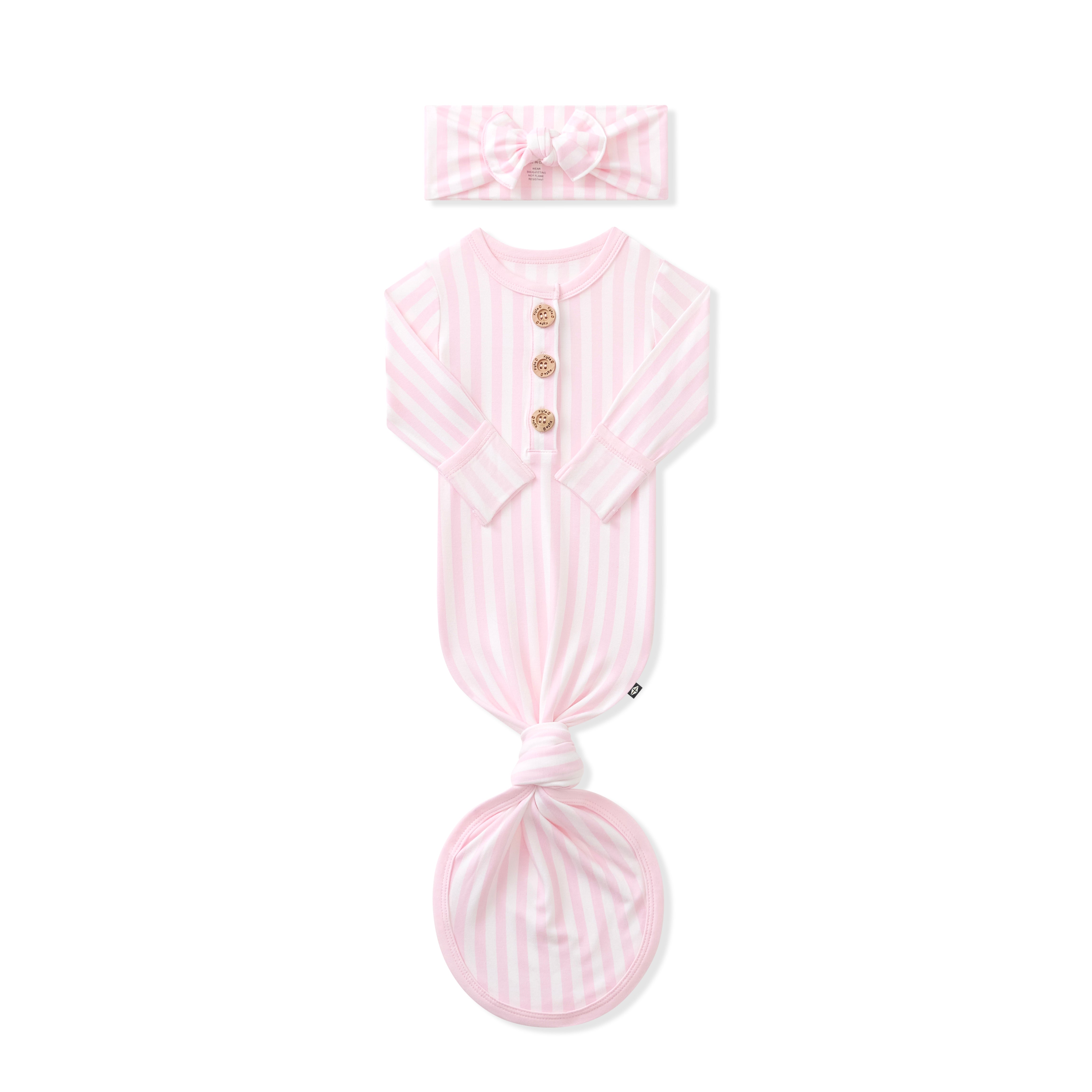 Knotted Gown with Bow Set in Small Sakura Stripe shown with the arms folded in laying on a white background